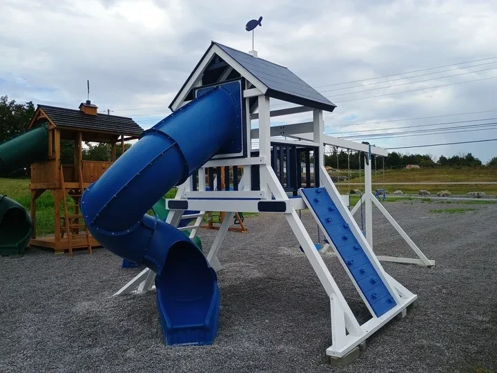White and blue vinyl playset with a wide base and climbing wall
