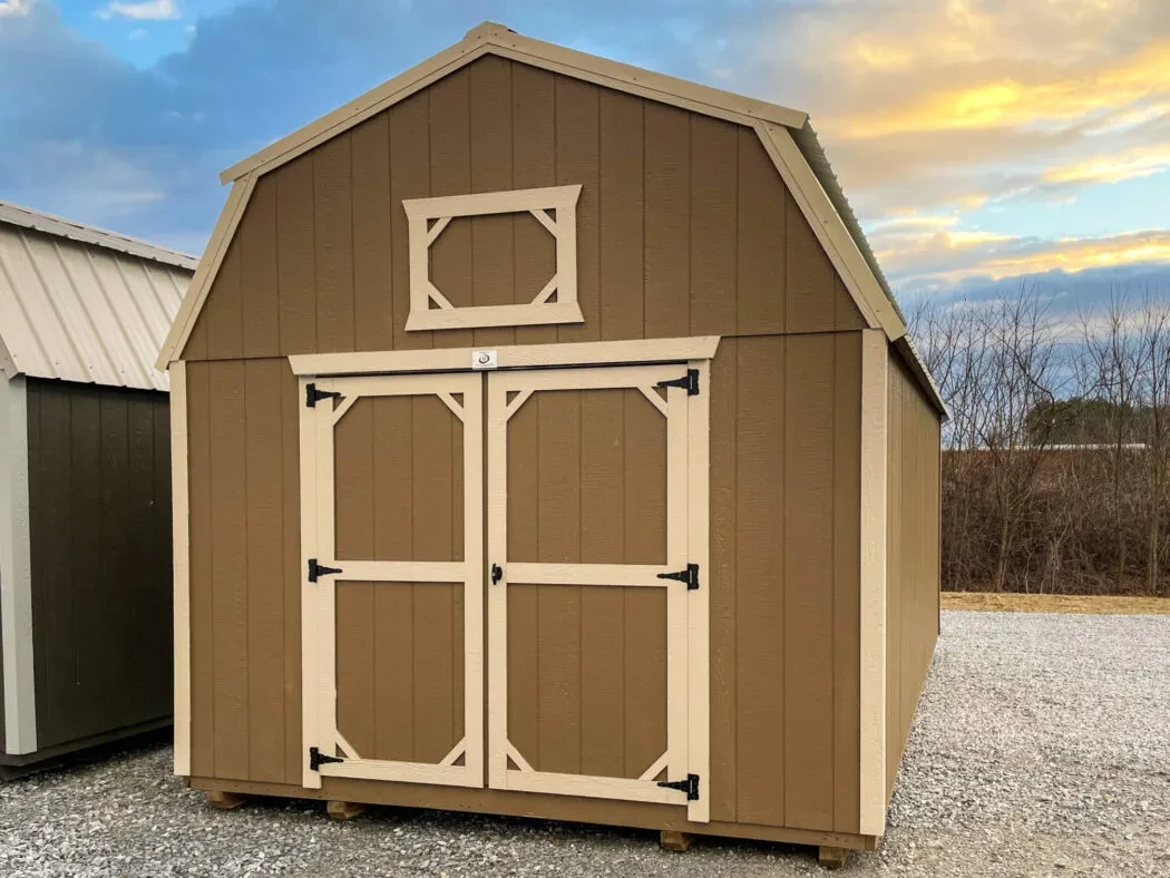 a brown and tan lofted barn wood shed