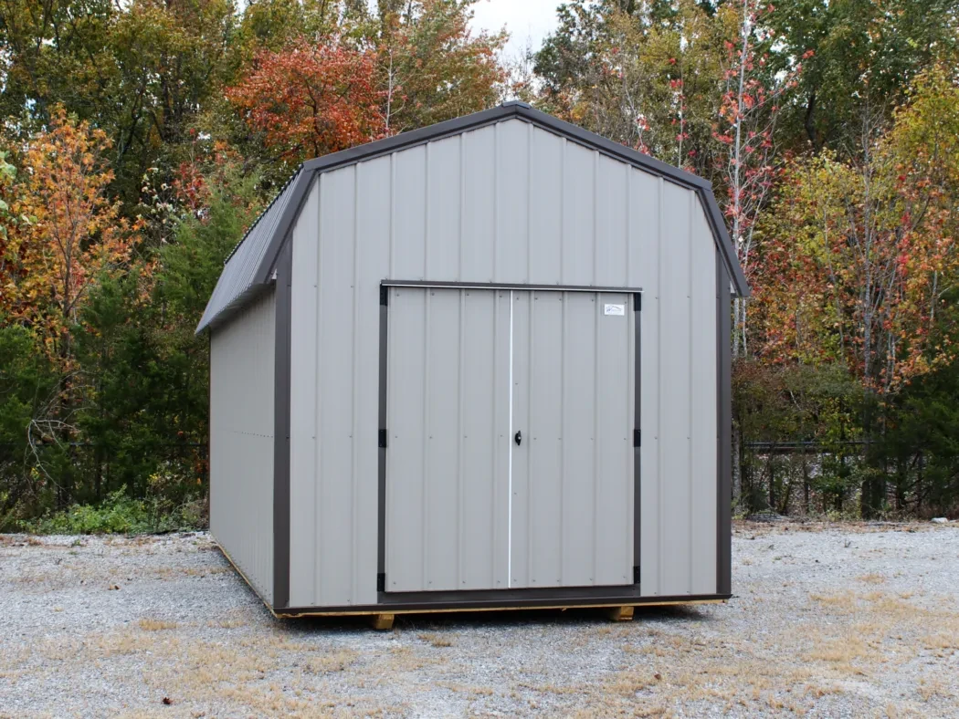 A clay colored metal lofted barn shed