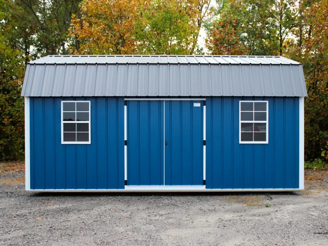 A dark blue metal side lofted shed