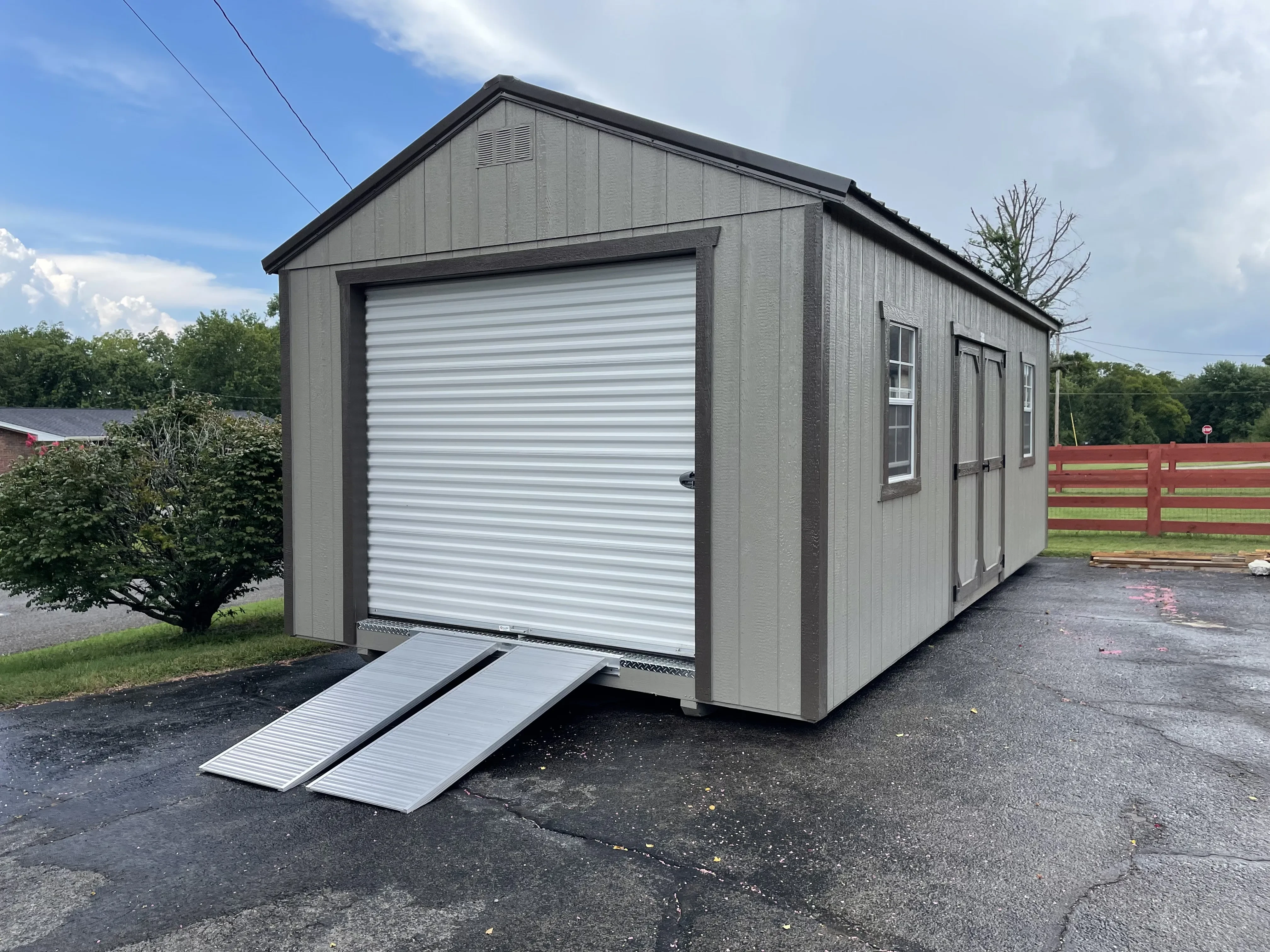 Clay and bronze garage with a aluminum ramp