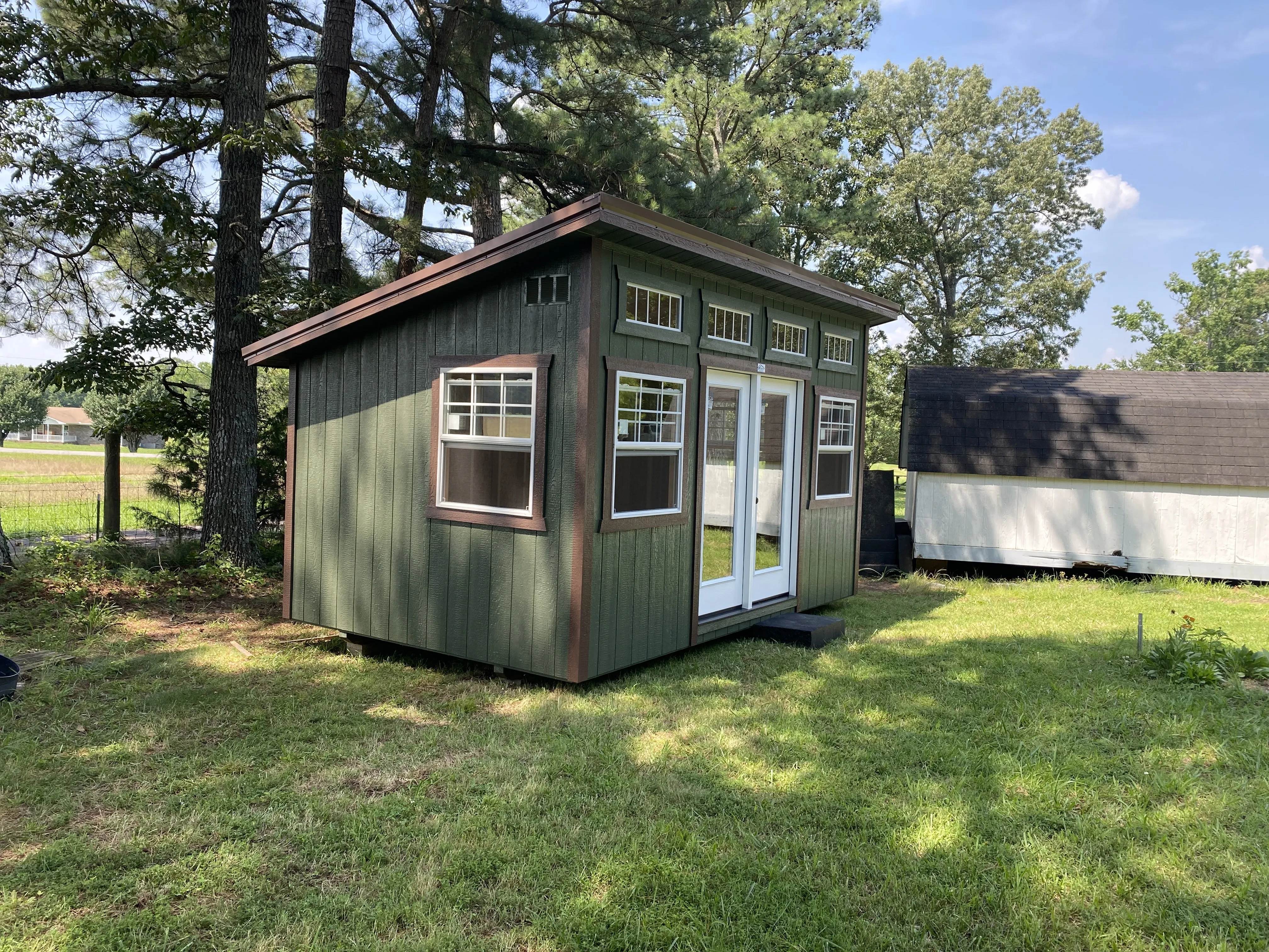 Green and brown studio shed
