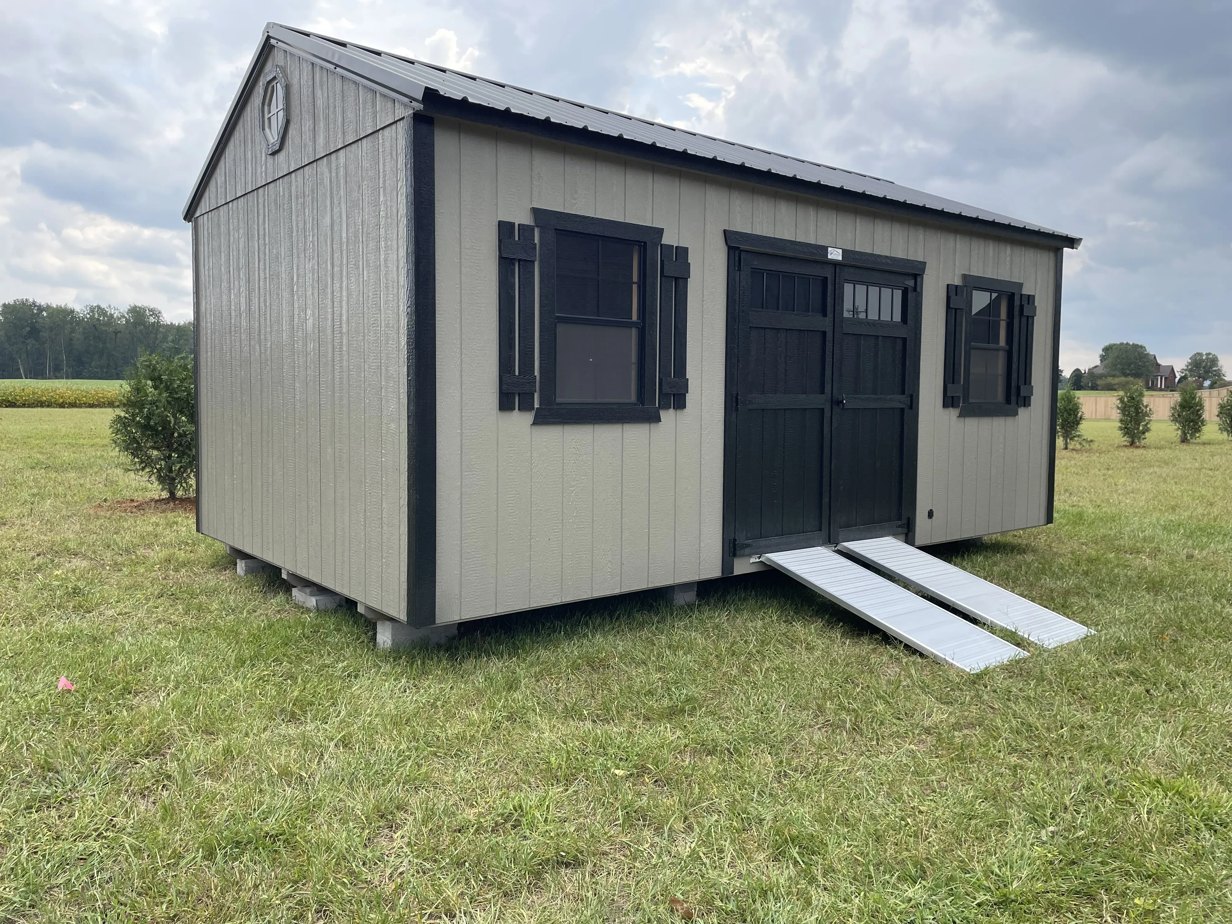 Clay and black Garden Shed with shutters and the ramp