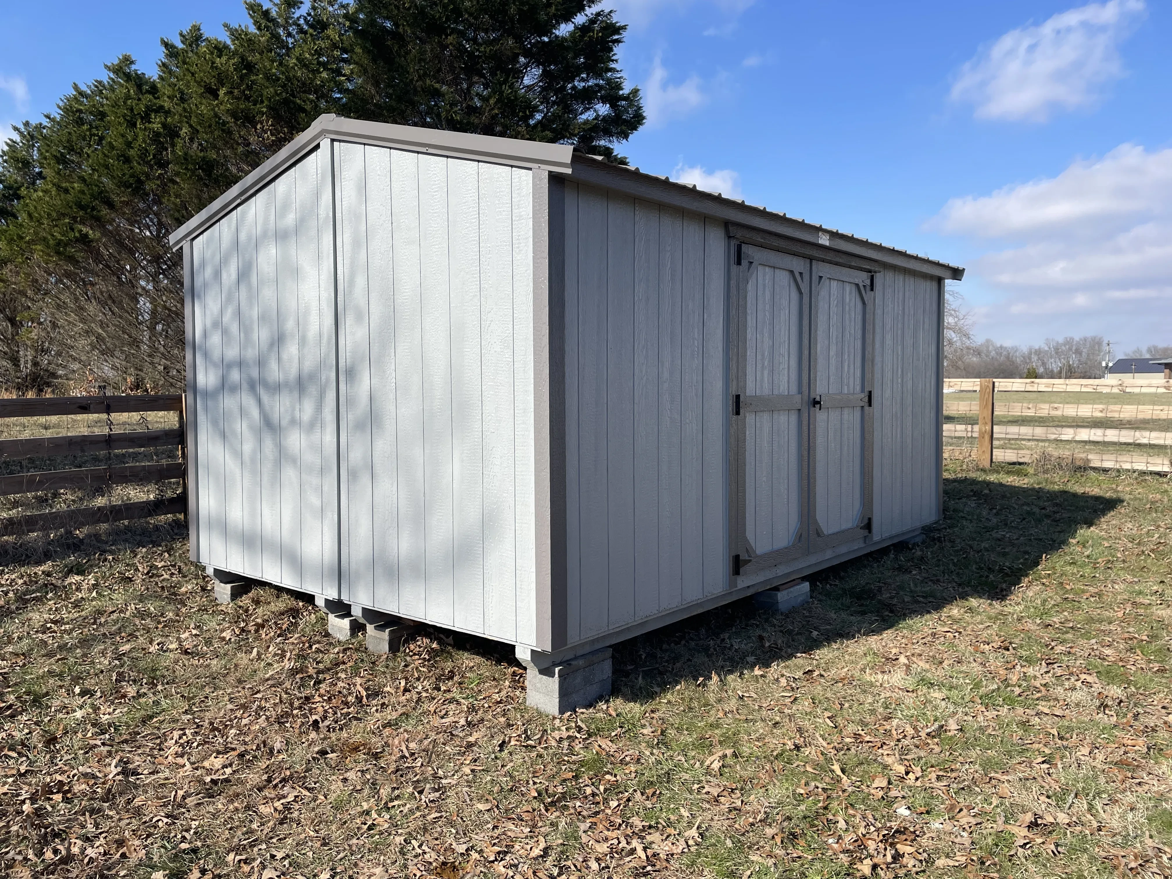 gray and charcoal split-shed set up in yard