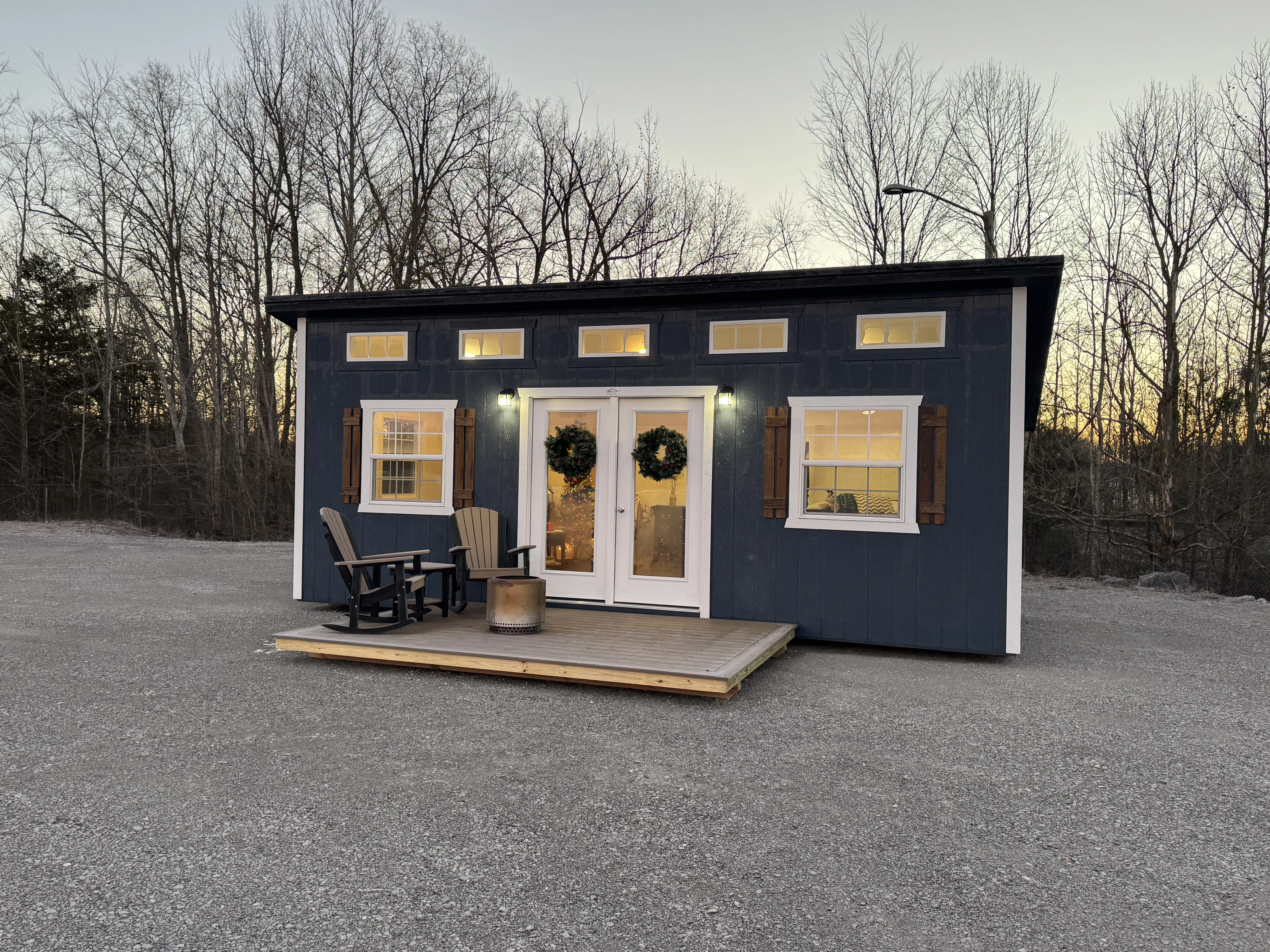 Fully finished and lit studio shed with porch in front