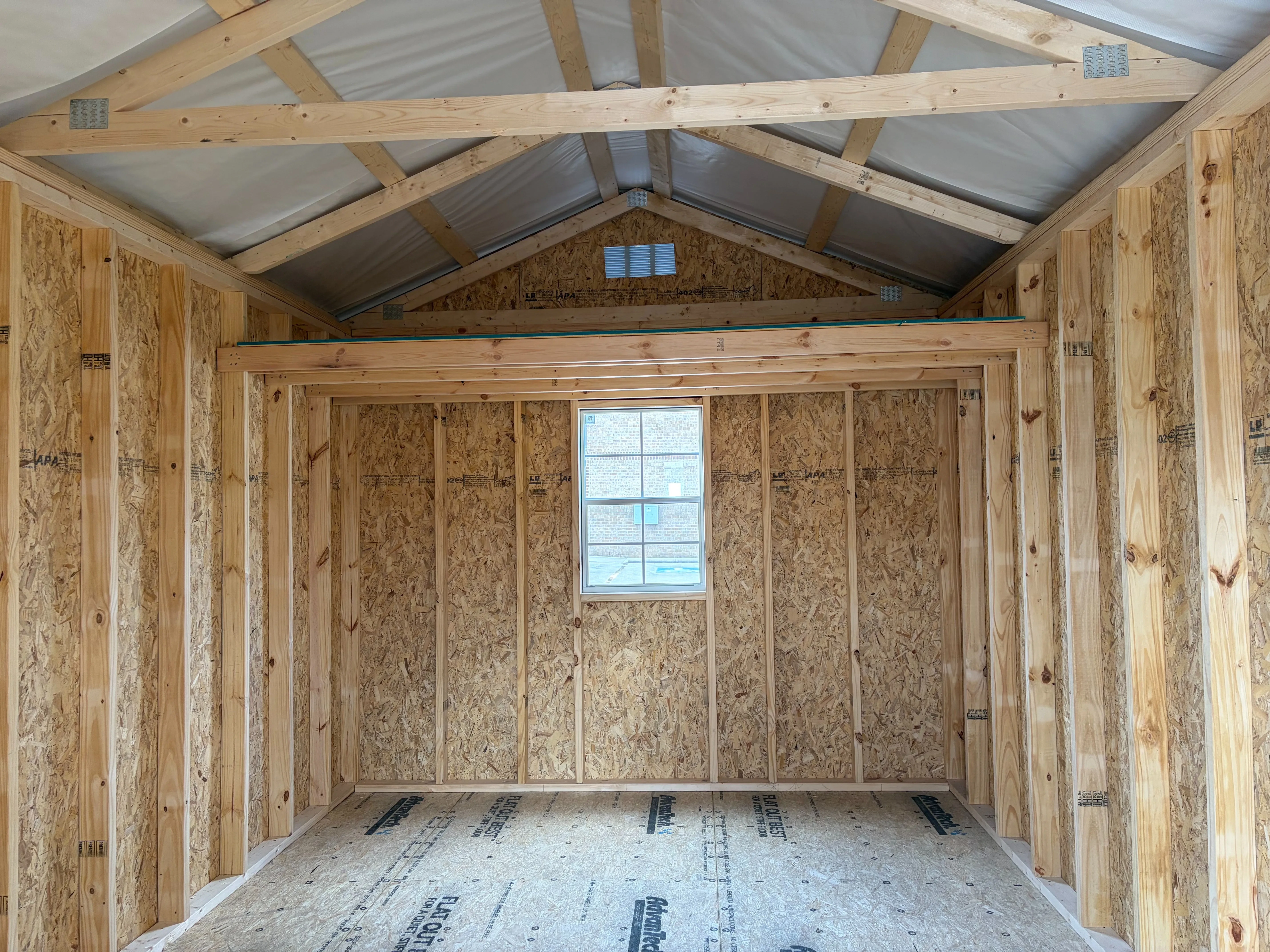 the interior has double doors, window, loft and foil roof