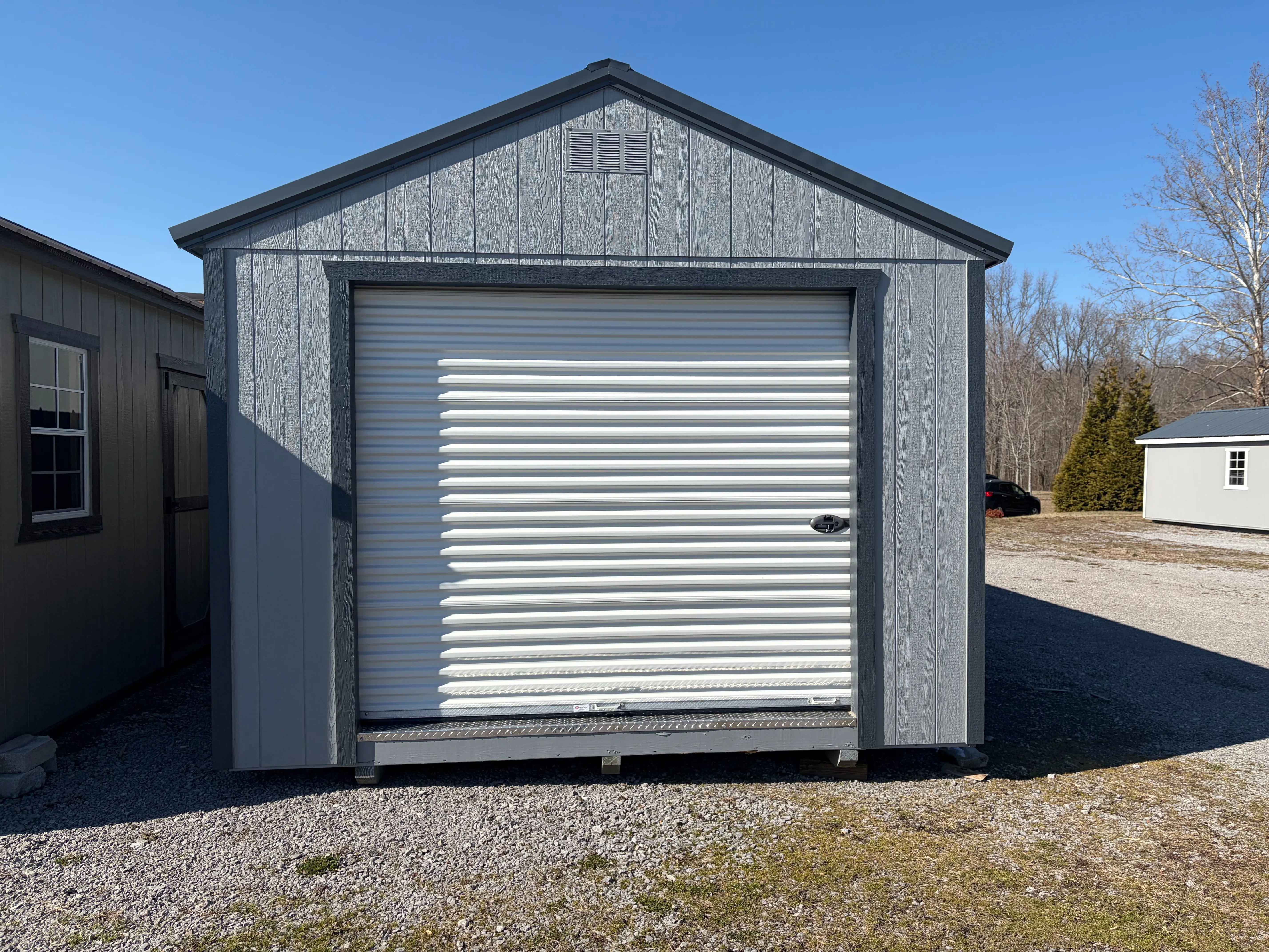 the exterior rollup garage door into a wood garage shed