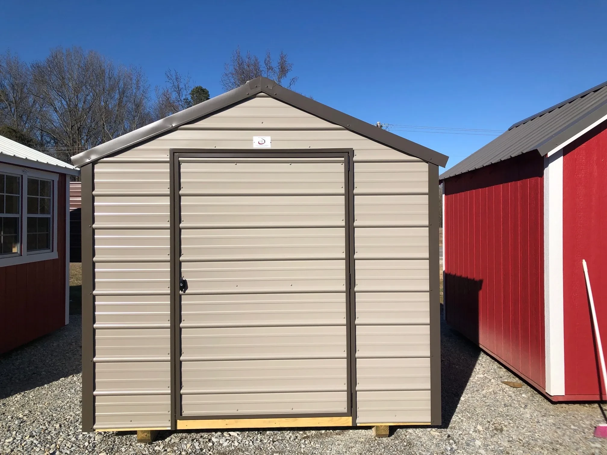 small metal shed with a single door