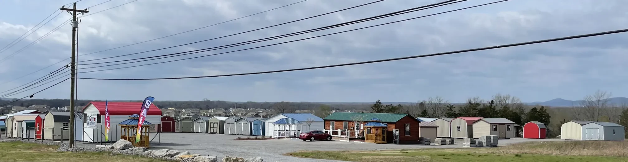 wide angle view of murfreesboro south lot stocked with many sheds