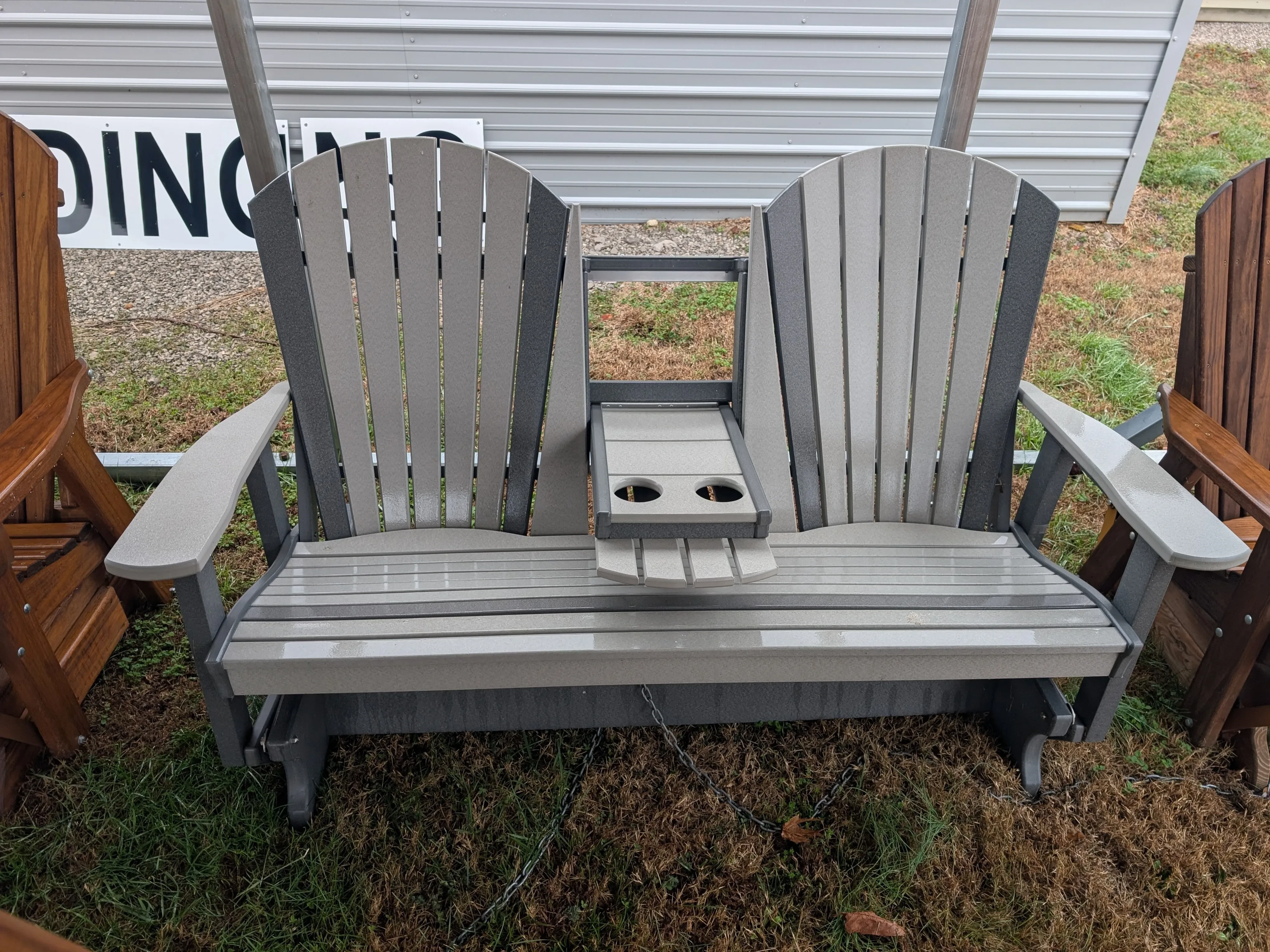 a light gray bench with dark gray accents. It has a center console in the down position
