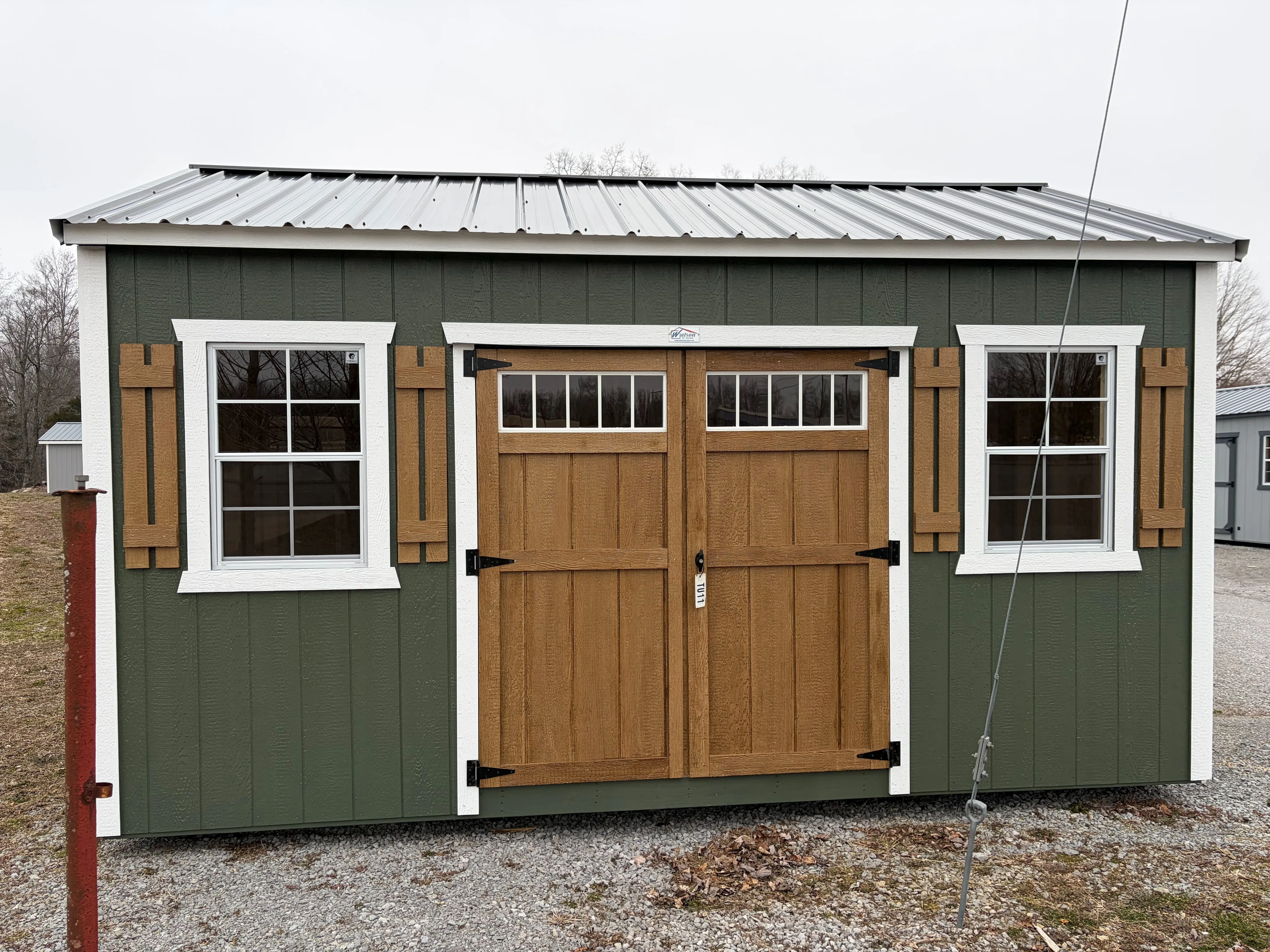 outside of a painted garland green and white sides with a black metal roof