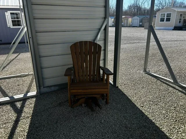 a wood stained chair sitting under a carport