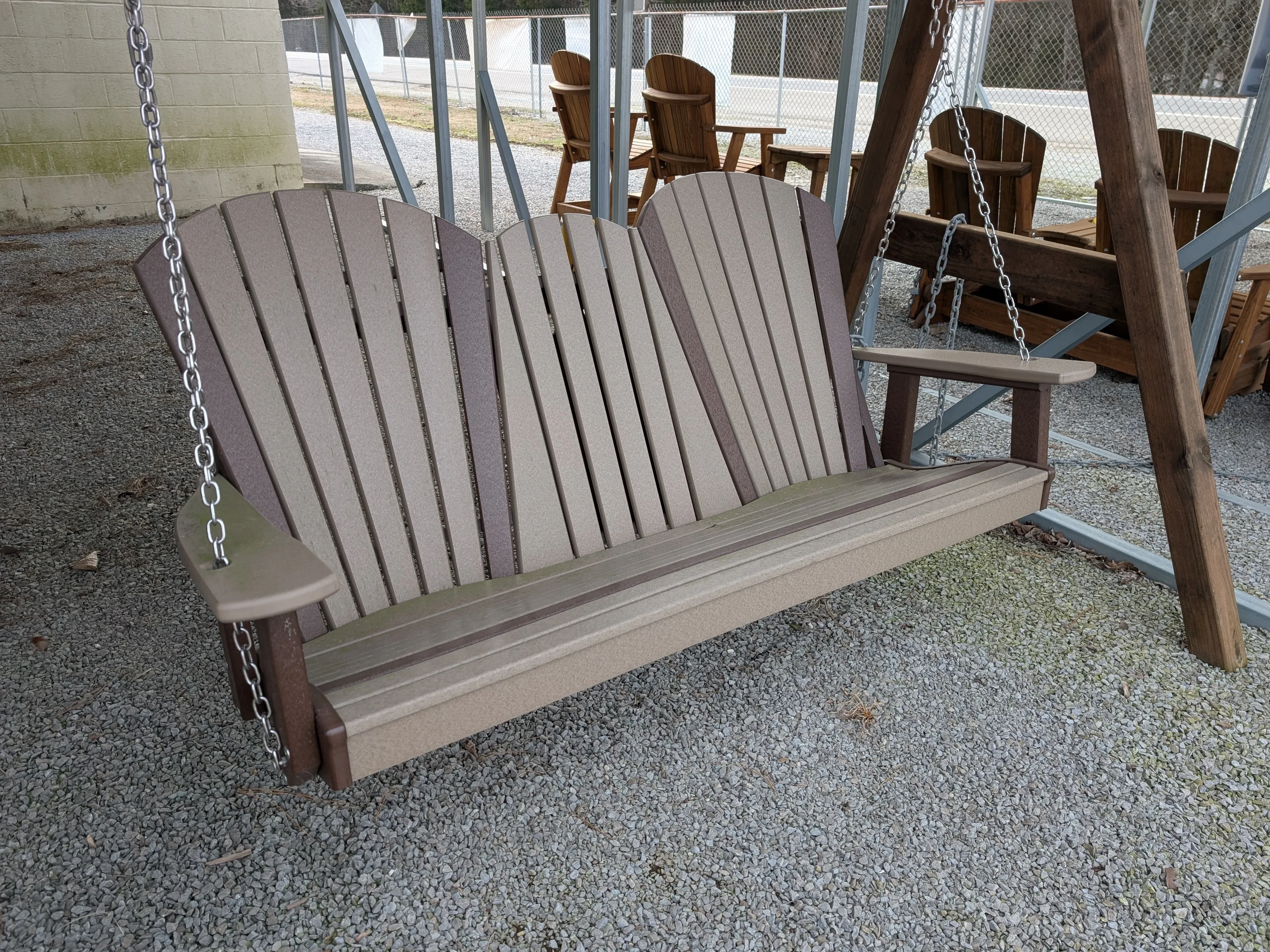 a light gray bench swing. It has dark gray accents