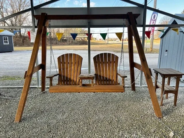 the front view of a wood bench with two seats and a center console with cupholders