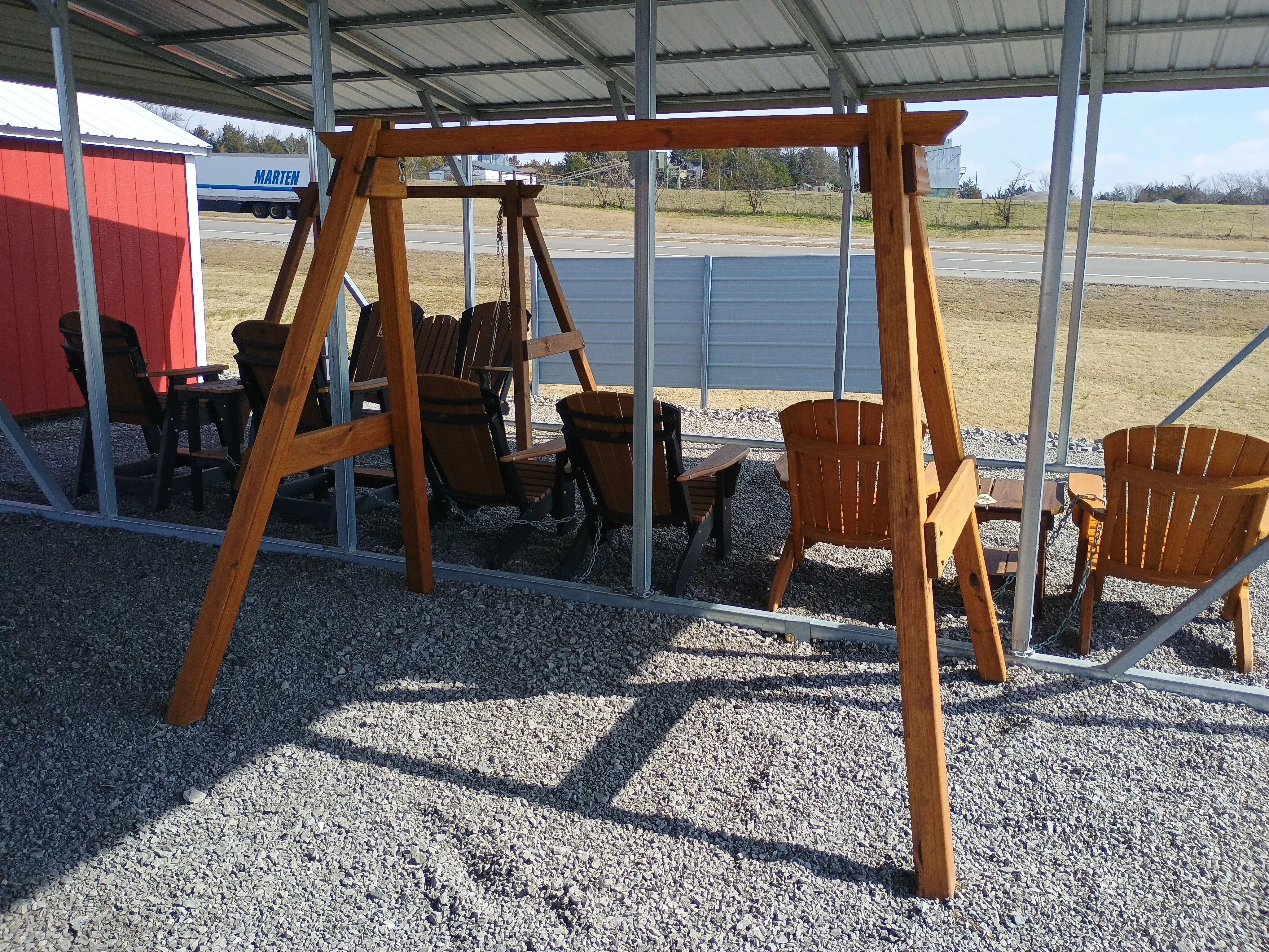 a stained and sealed a-frame structure. It is meant to hold up a swing or bench