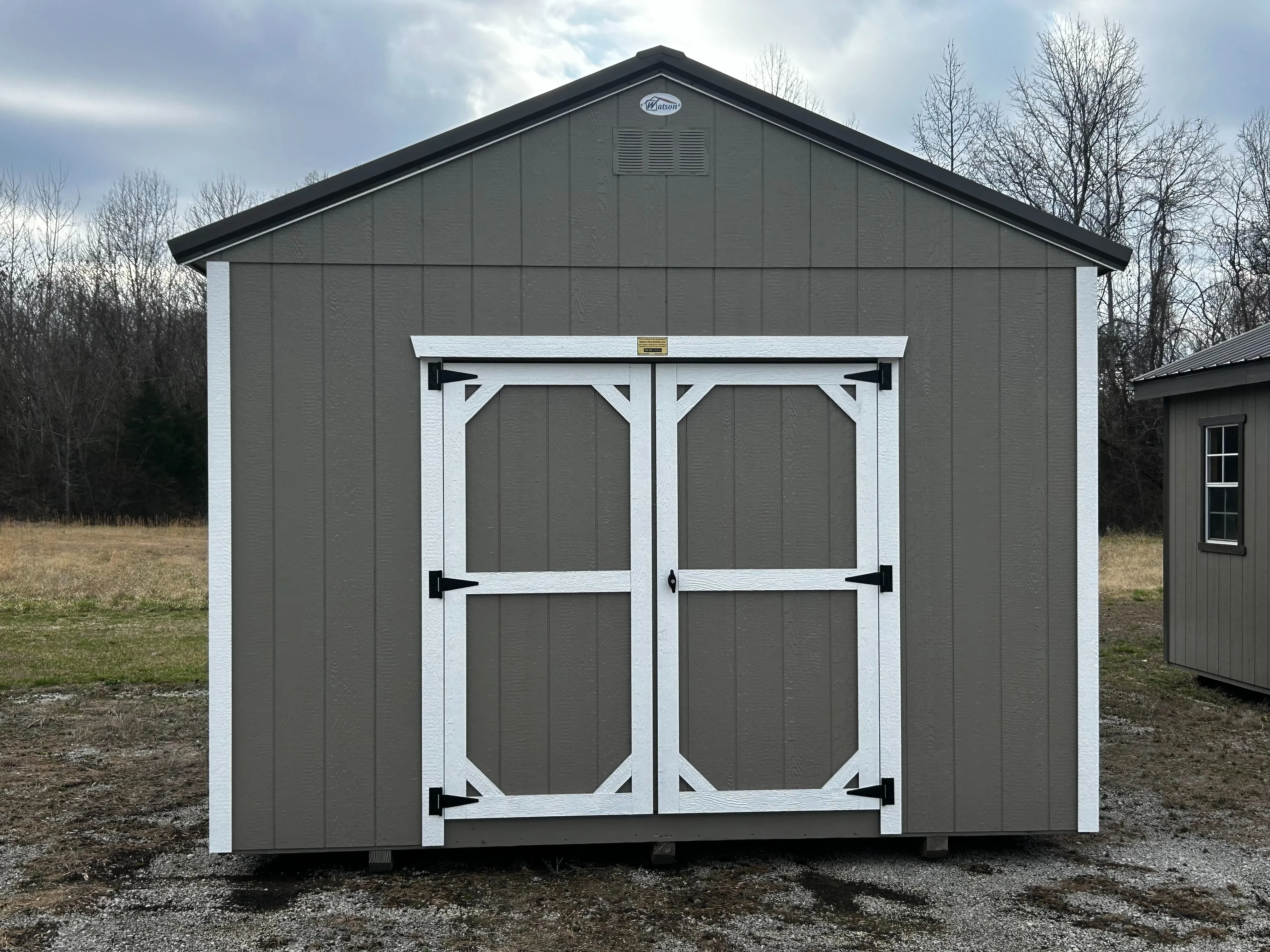 The front view of 12x20 classic wooden utility shed.