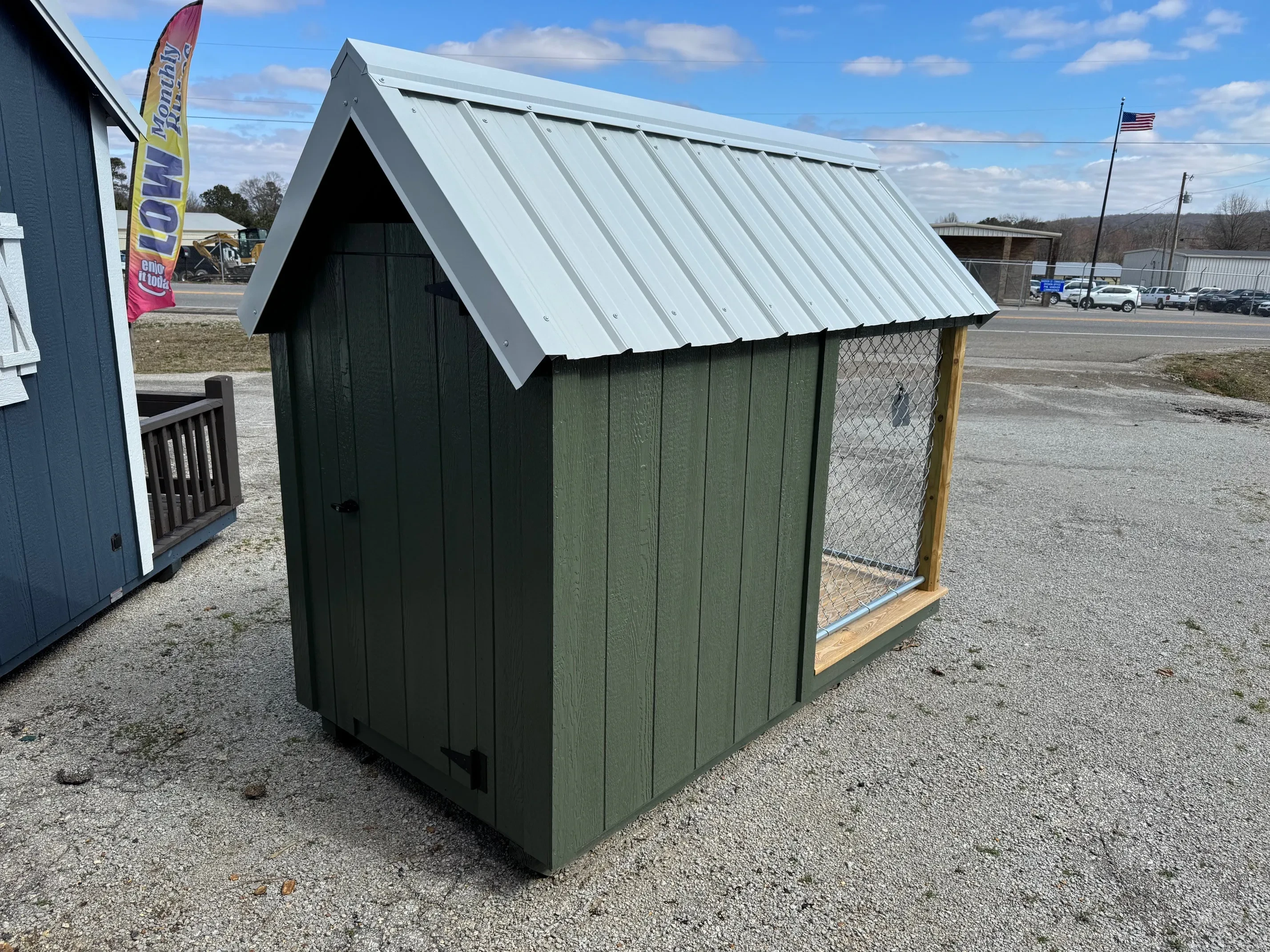 Back of 4X8 dog house, white roof and garland green body with walk in door. exterior
