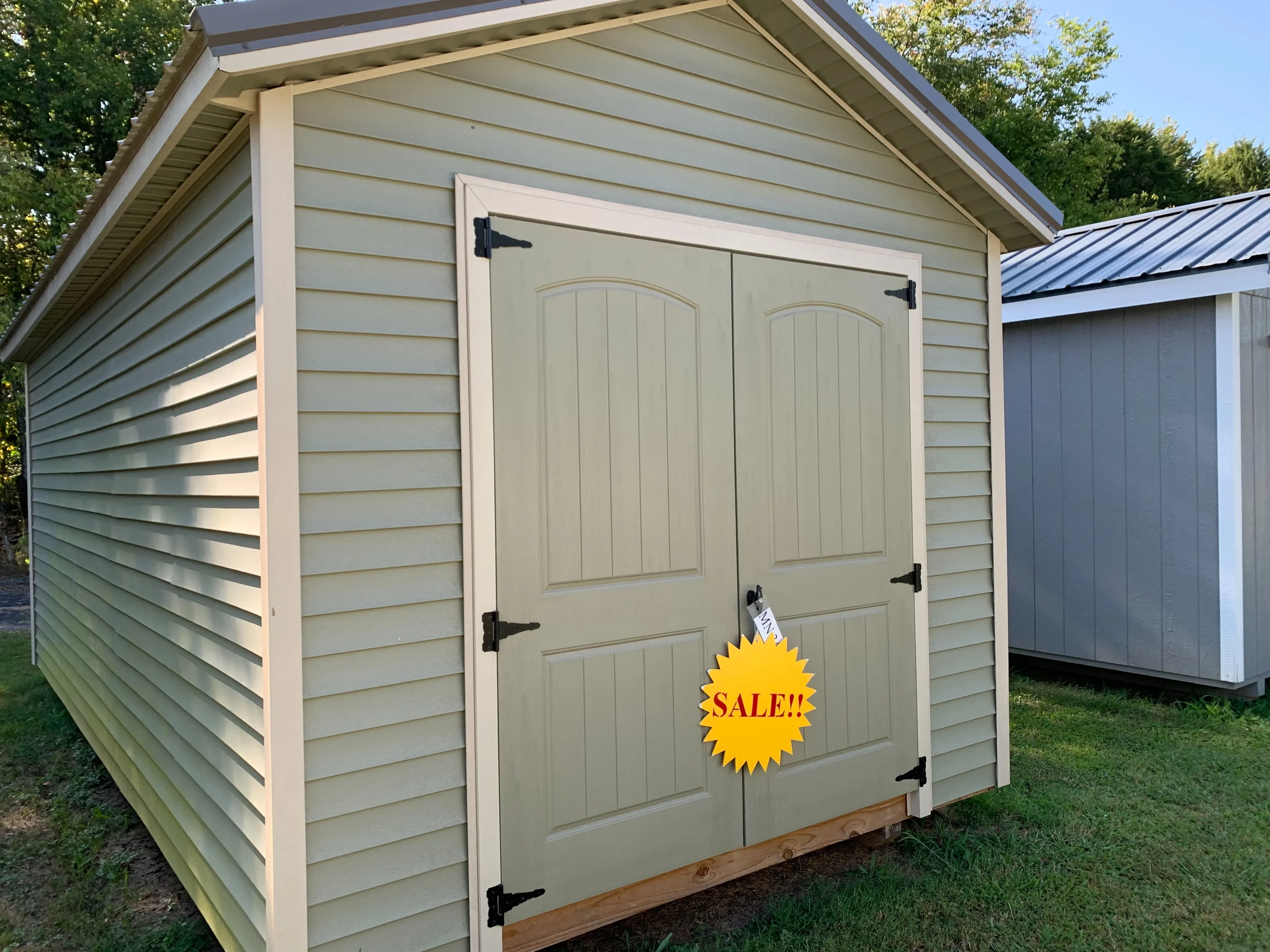 10x20 vinyl utility shed, cypress in color, pearl trim and charcoal metal roof