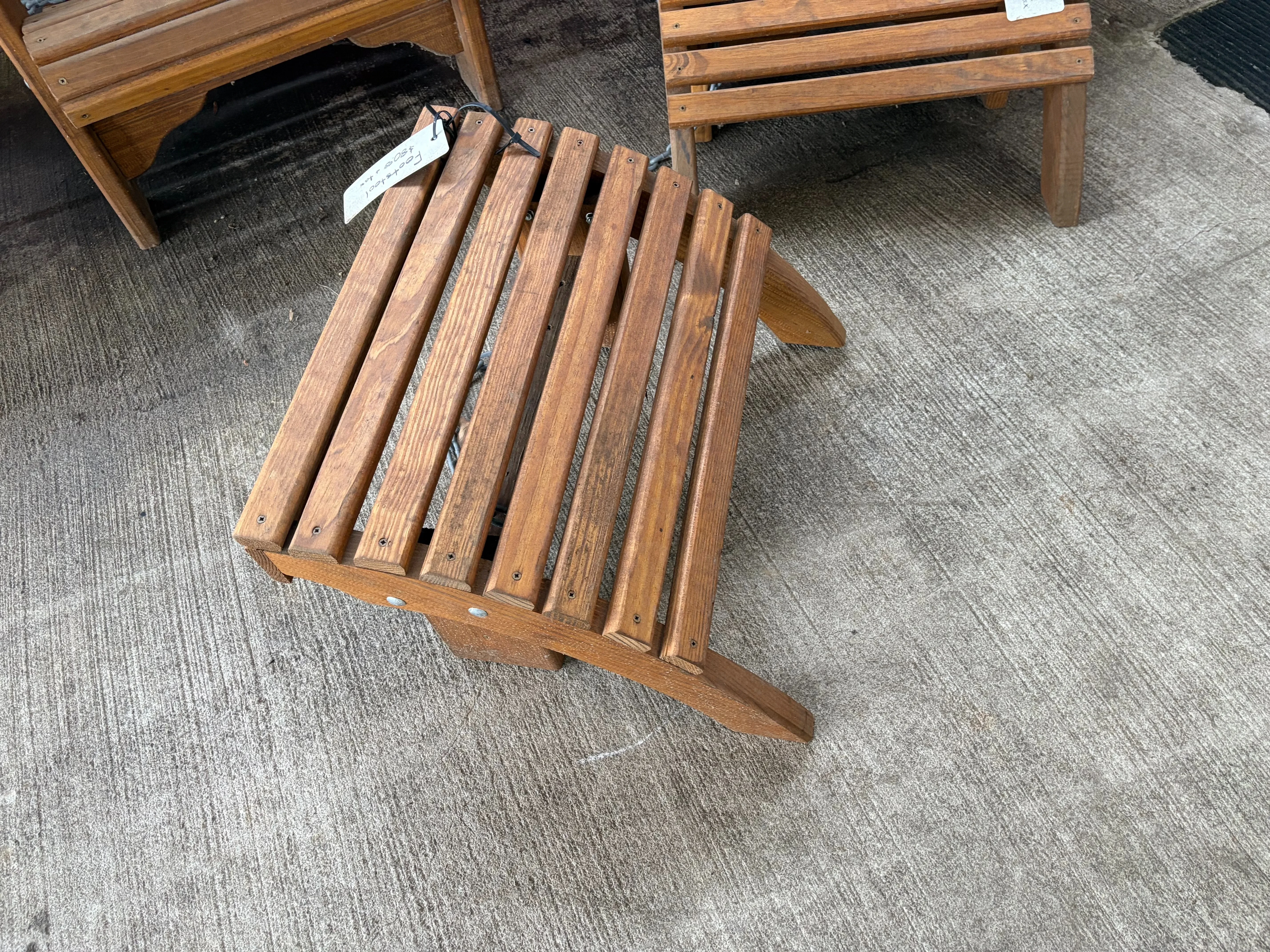 a foot stool sitting on concrete. It has been professionally stained and sealed to last