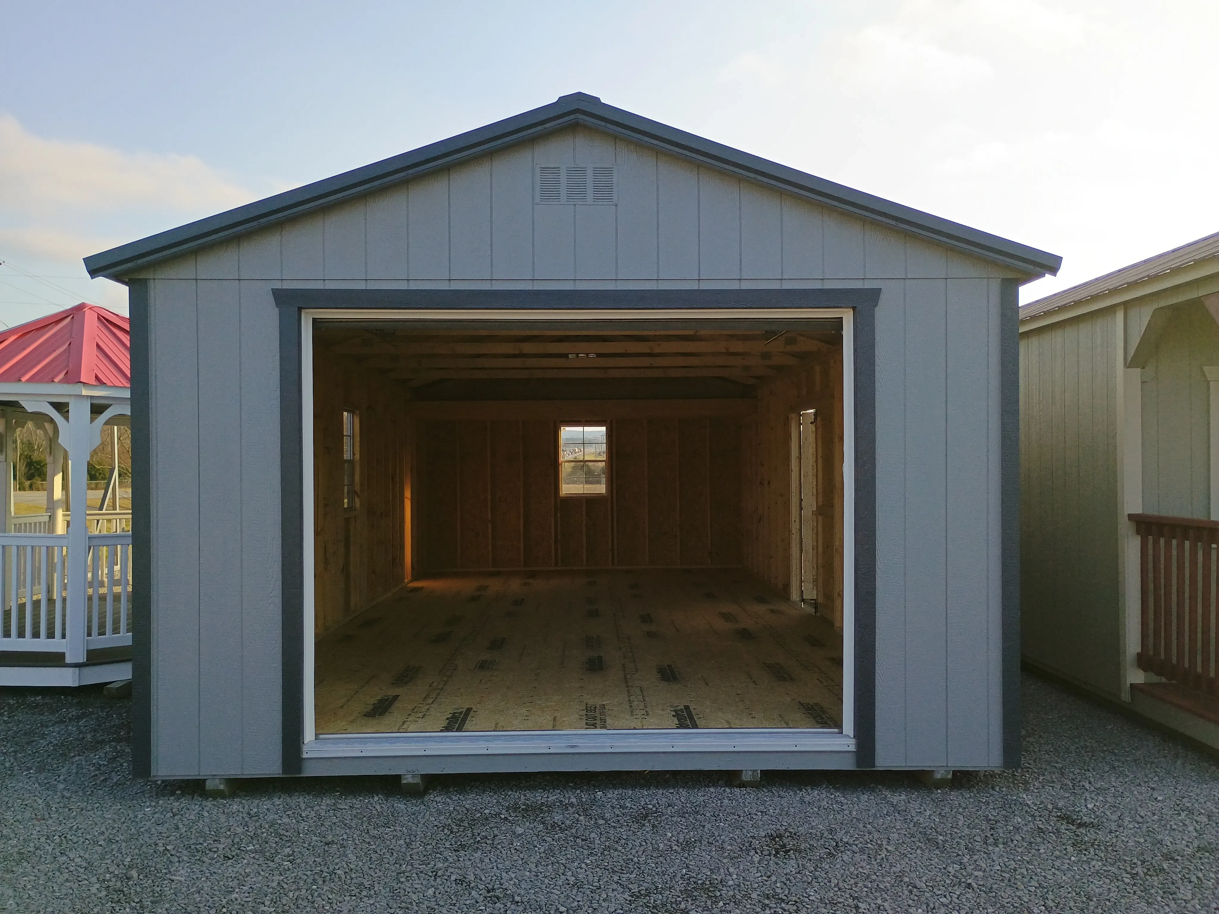 14x28 wood garage exterior with open overhead garage door to show interior