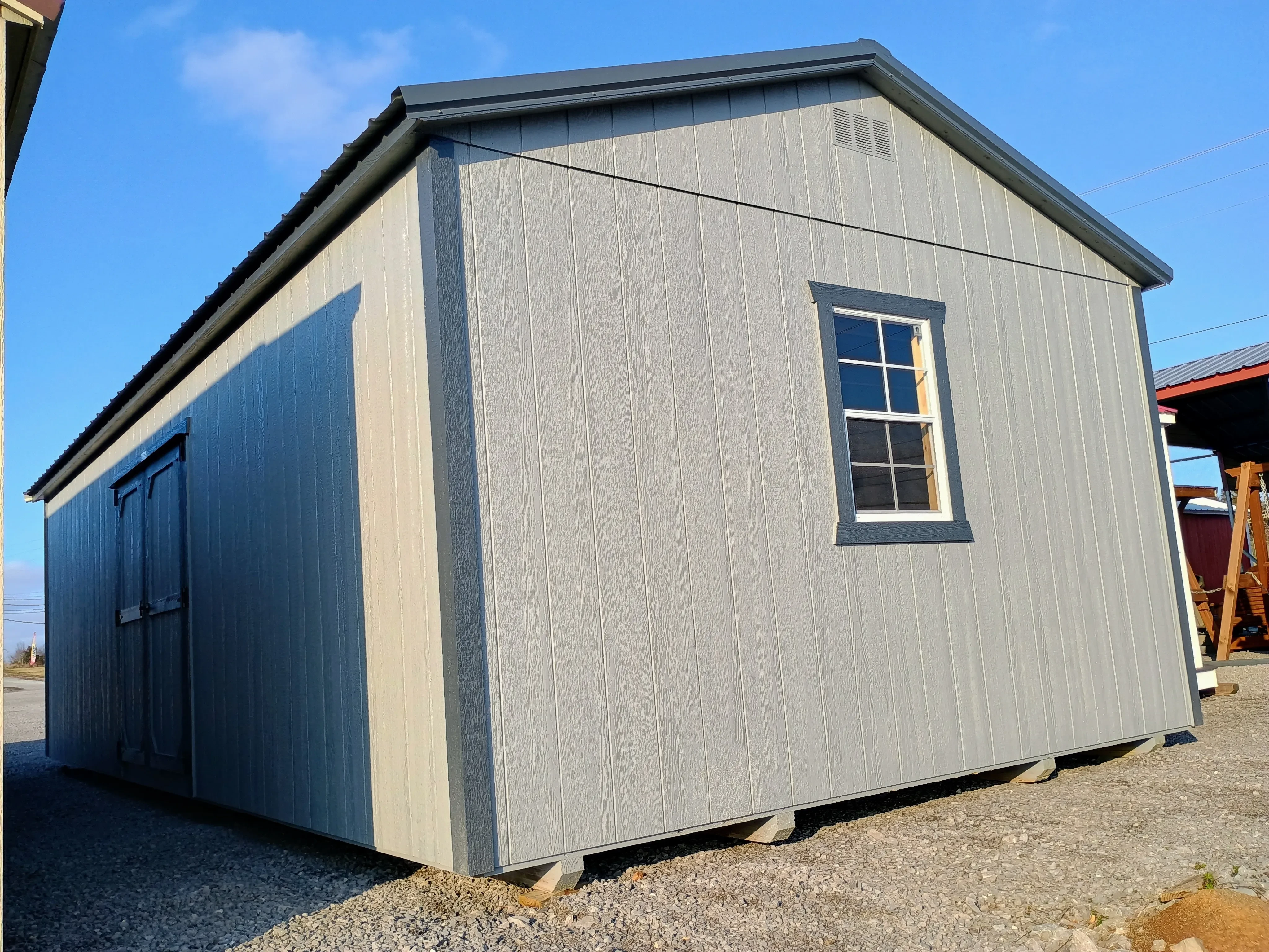 14x28 wood garage rear side exterior showing double doors and rear window