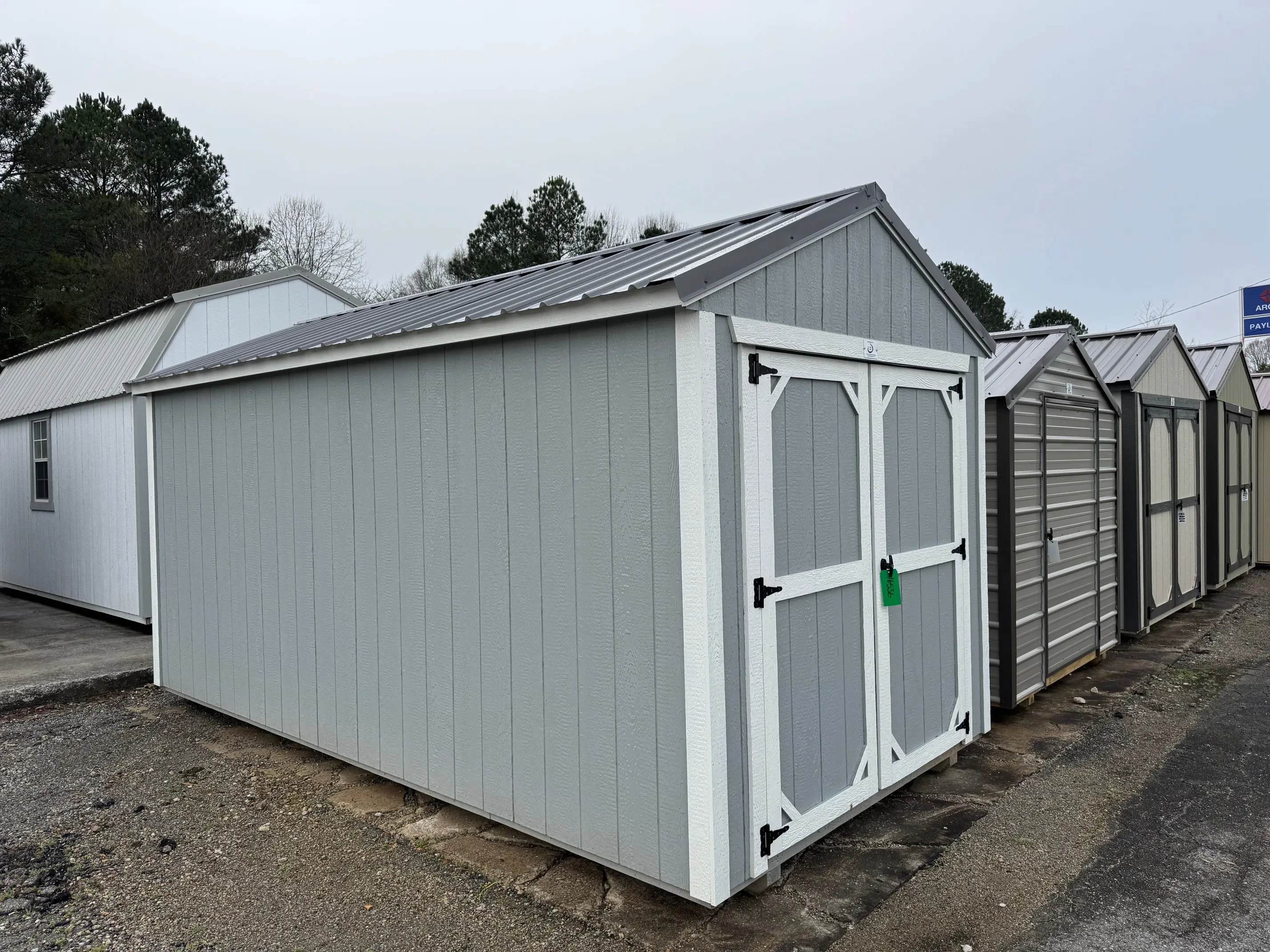 Outside of 8 X 16 Zook Gray Classic Wood Utility Shed With Double Doors, White Trim and Charcoal Roof