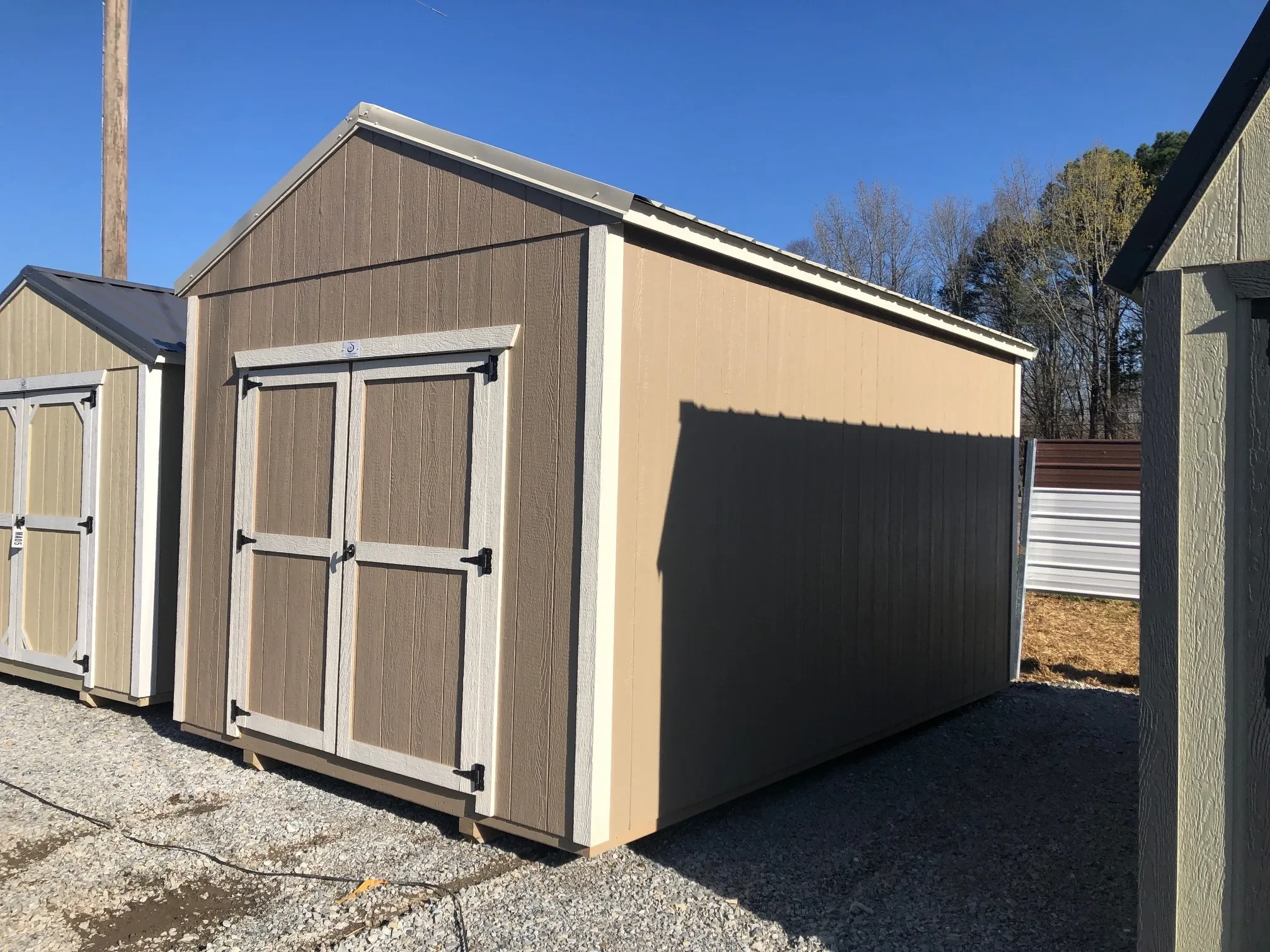 side view of a 10x16 storage shed showing double doors