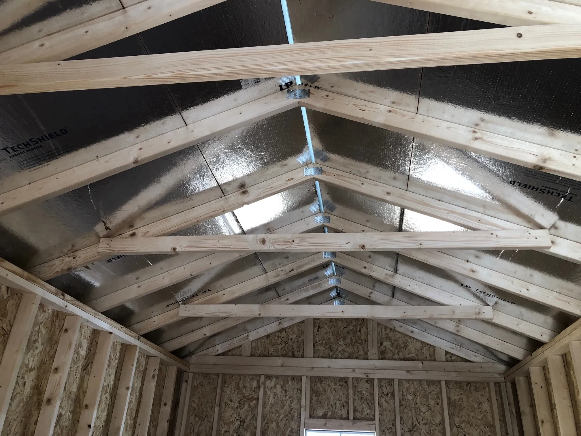 view of the ceiling on a 10x16 storage shed showing the roof insulation