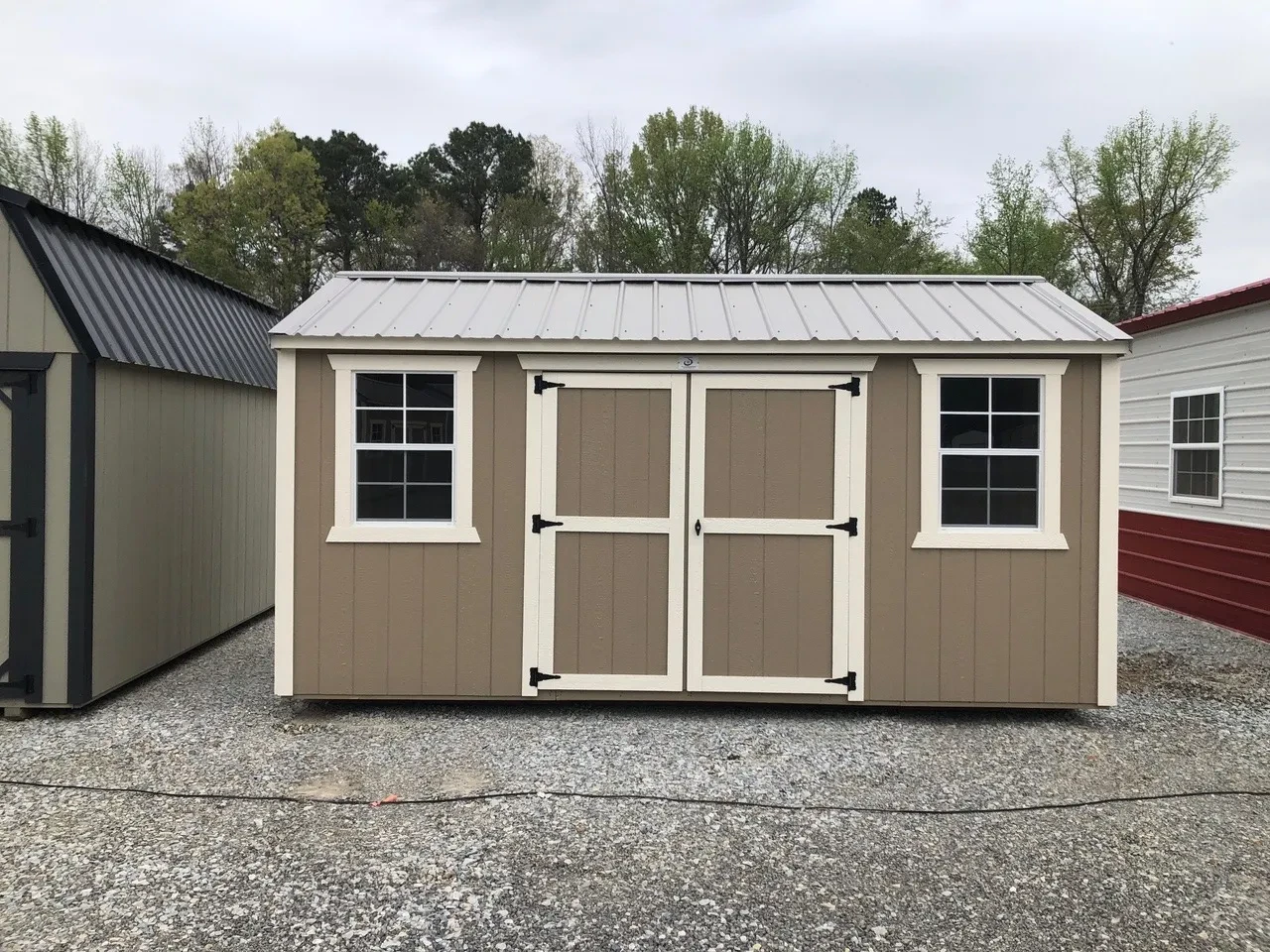exterior of 8x16 garden shed showing double doors and 2 windows