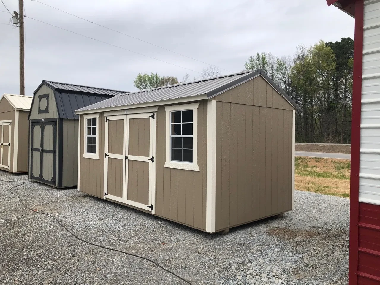 exterior of 8x16 garden shed showing double doors and 2 windows