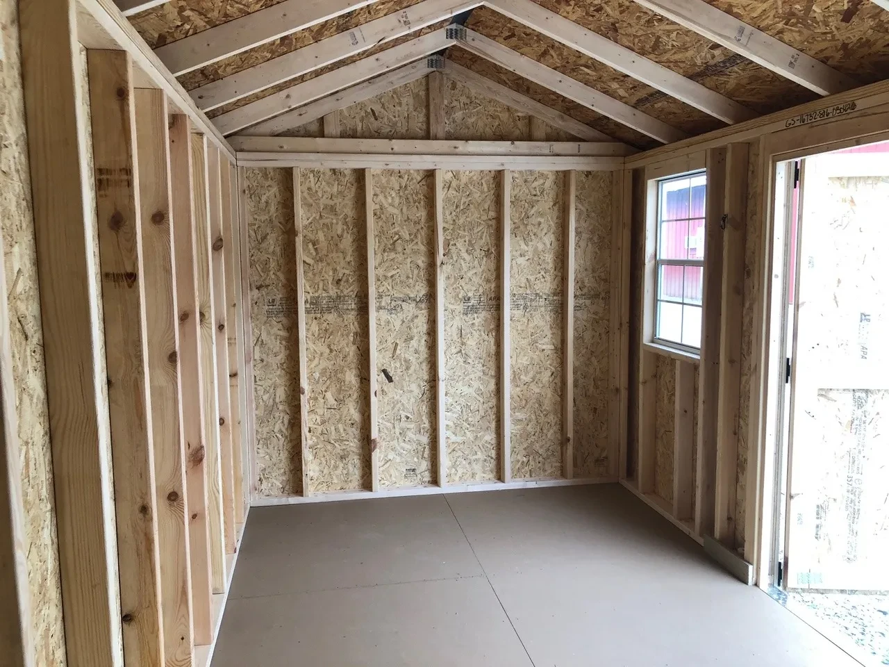 interior of 8x16 garden shed showing 1 window and open door