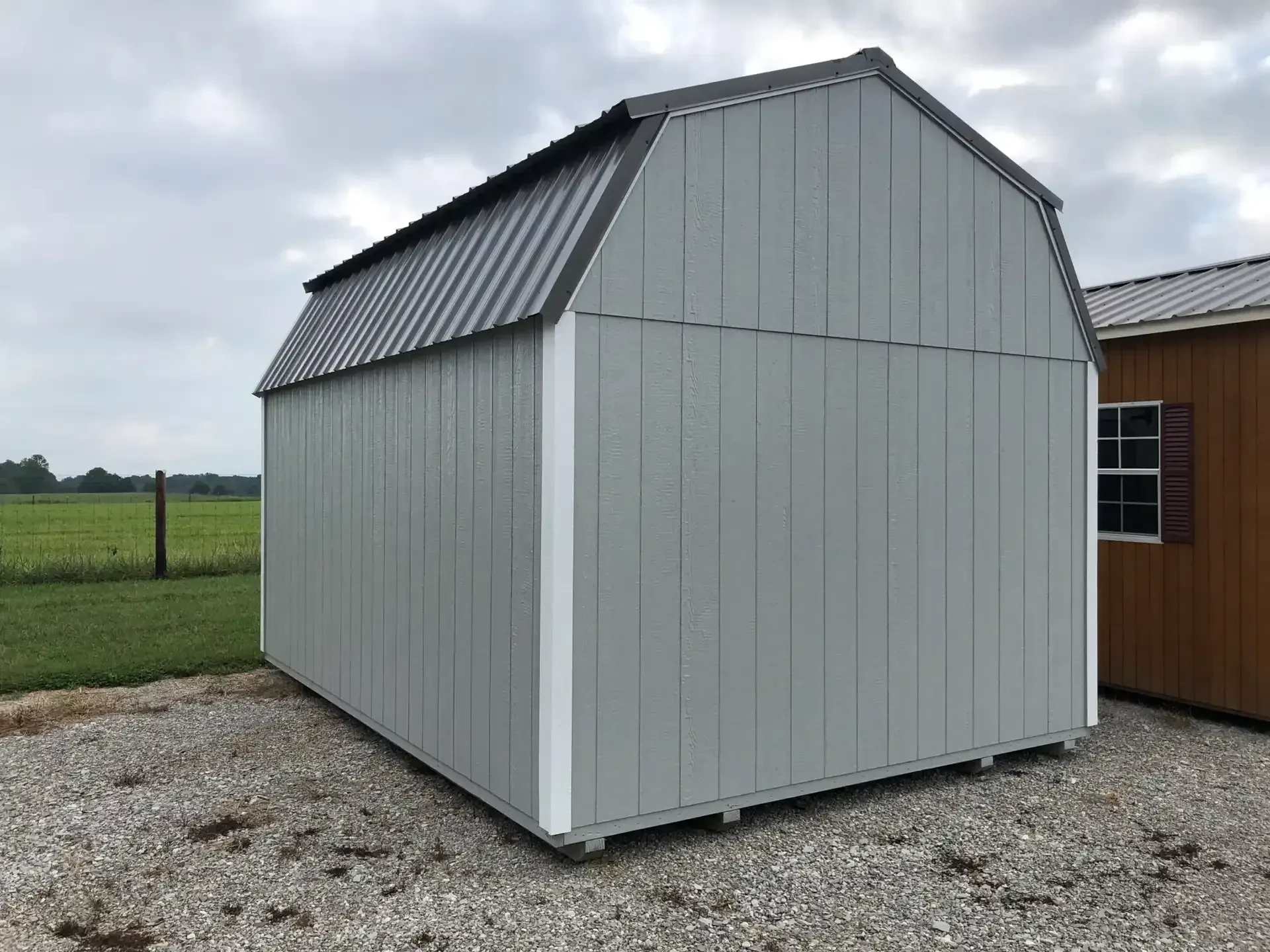 The back side of a lofted shed
