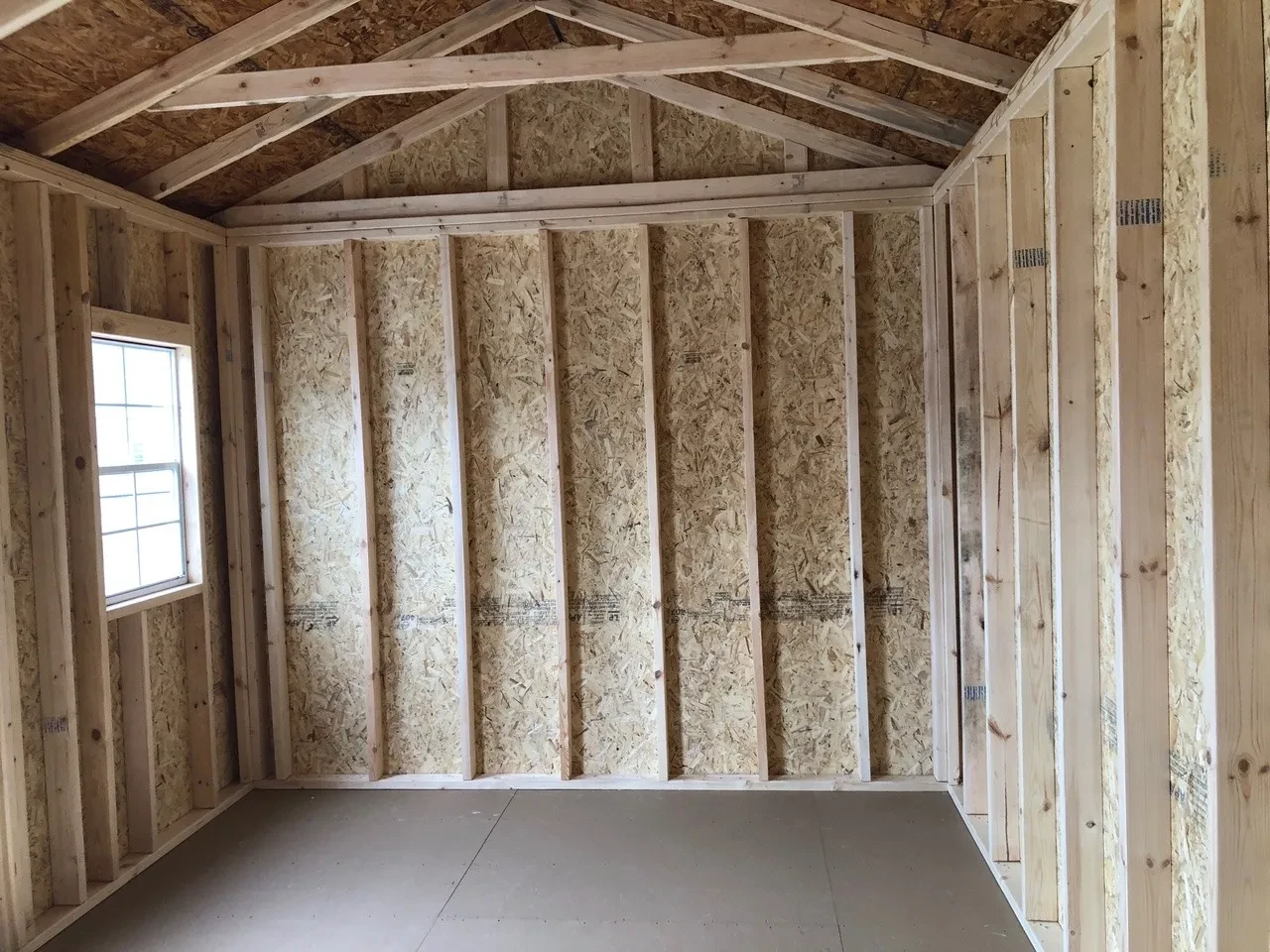 interior of 10x16 garden shed showing open door and window