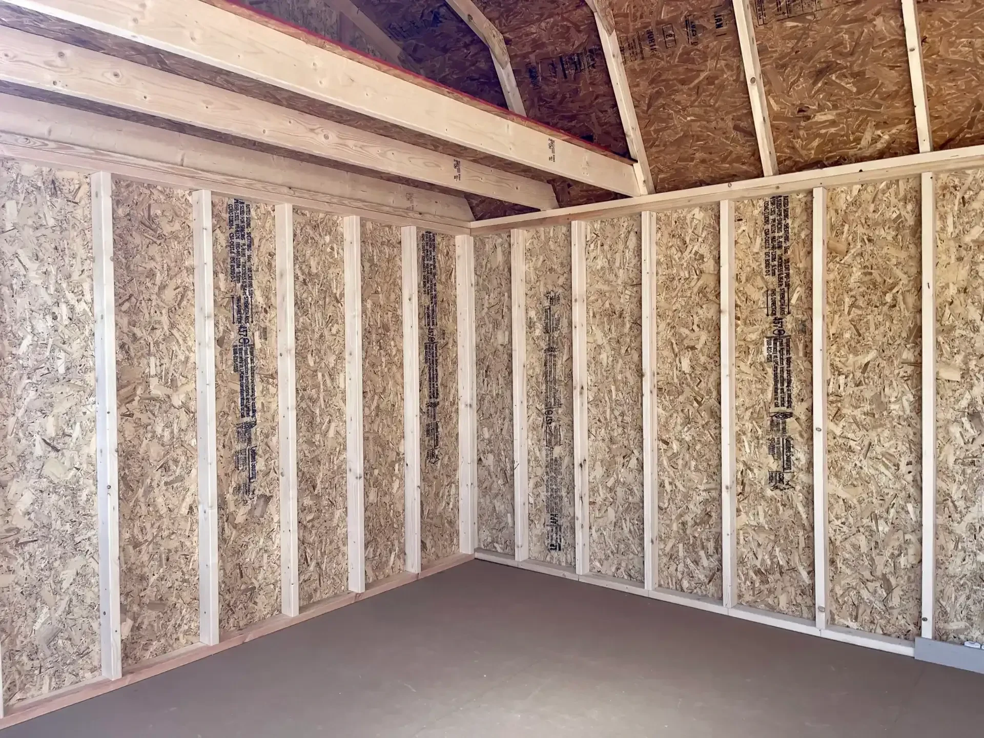The inside of a wood lofted barn