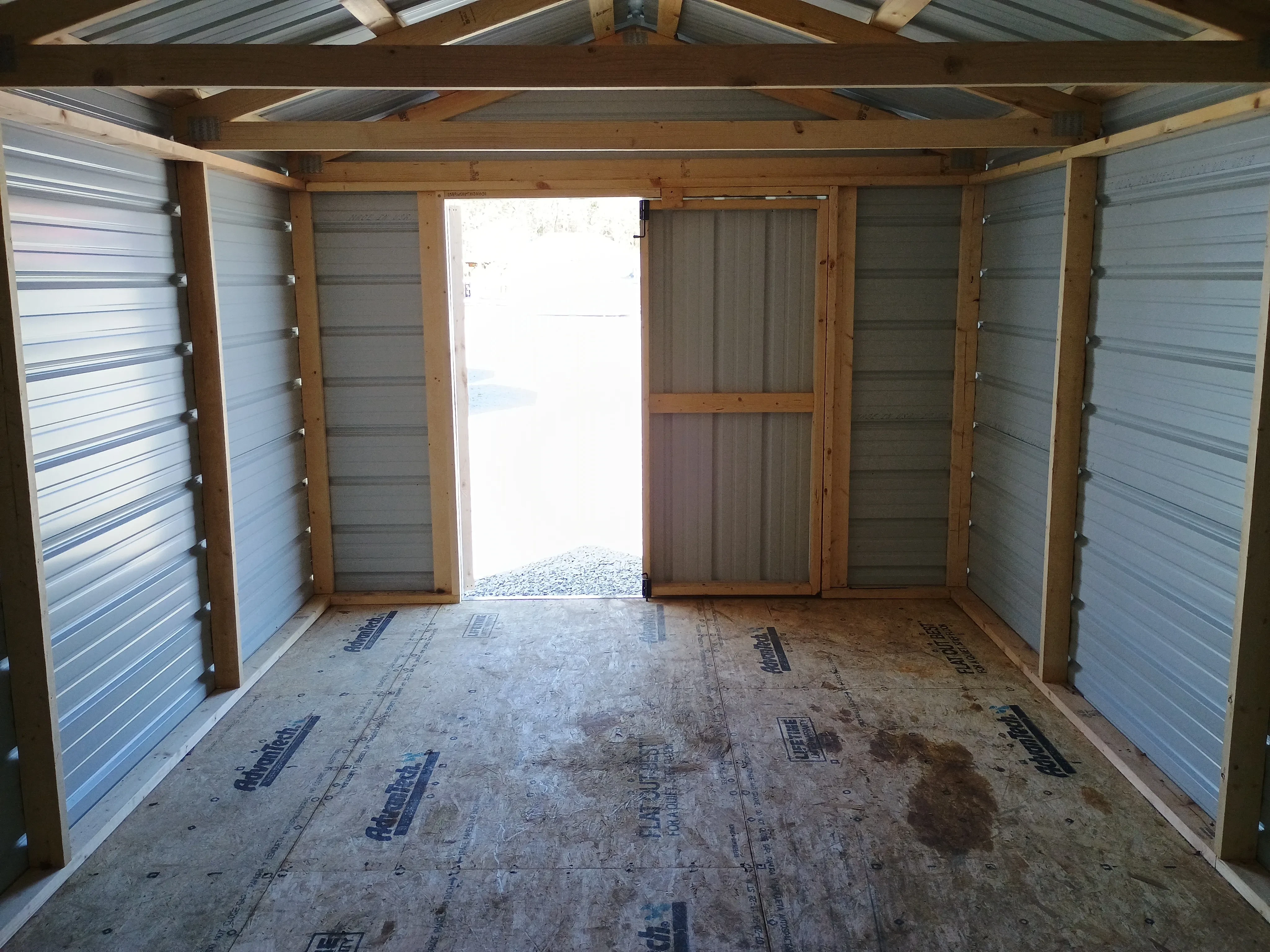 Interior of used REPO 10x20 Value Metal Shed, looking back toward the doors.