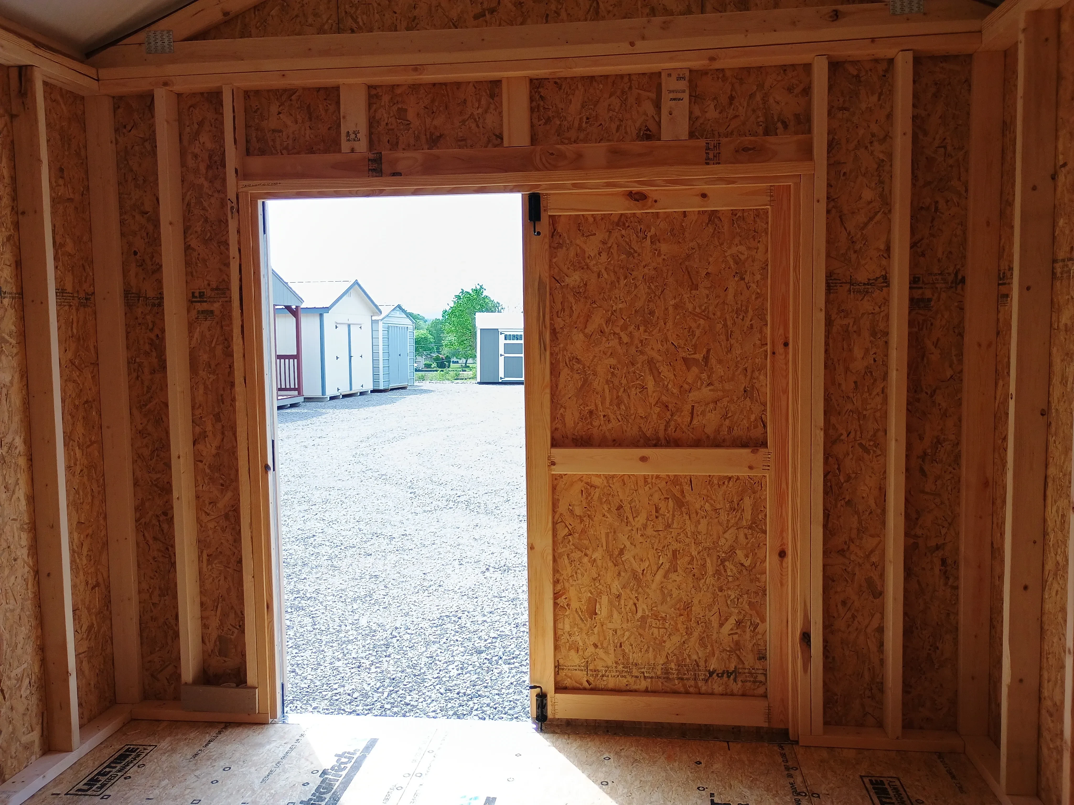 Inside of 10x12 Classic Wood Utility Shed, looking back toward the Doors