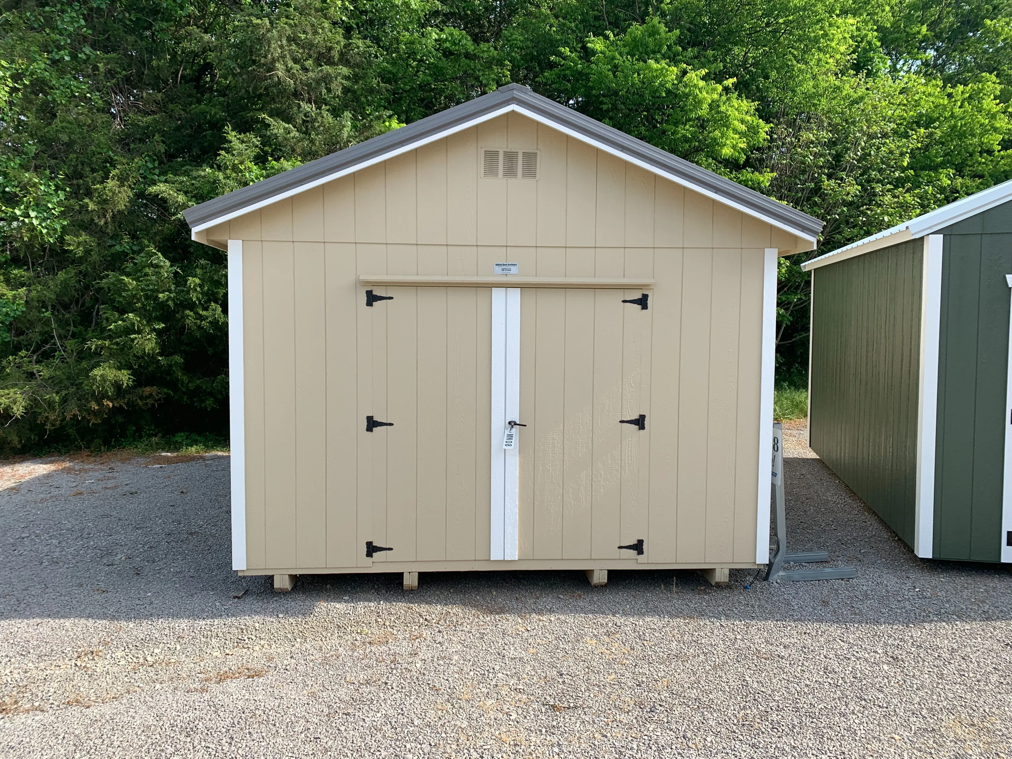 12x20 Premium shed. color is stone, white trim and charcoal metal roof. 1 loft, double shelves, window and 72" doors.