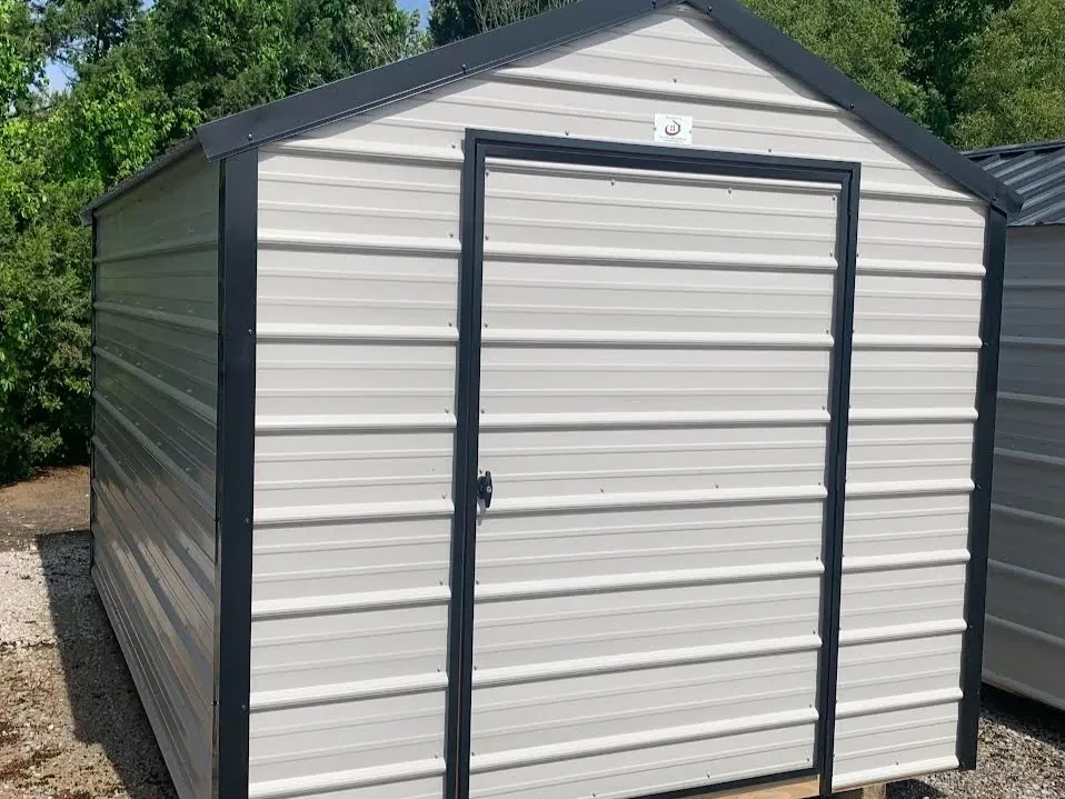 gray barn with black roof and trim