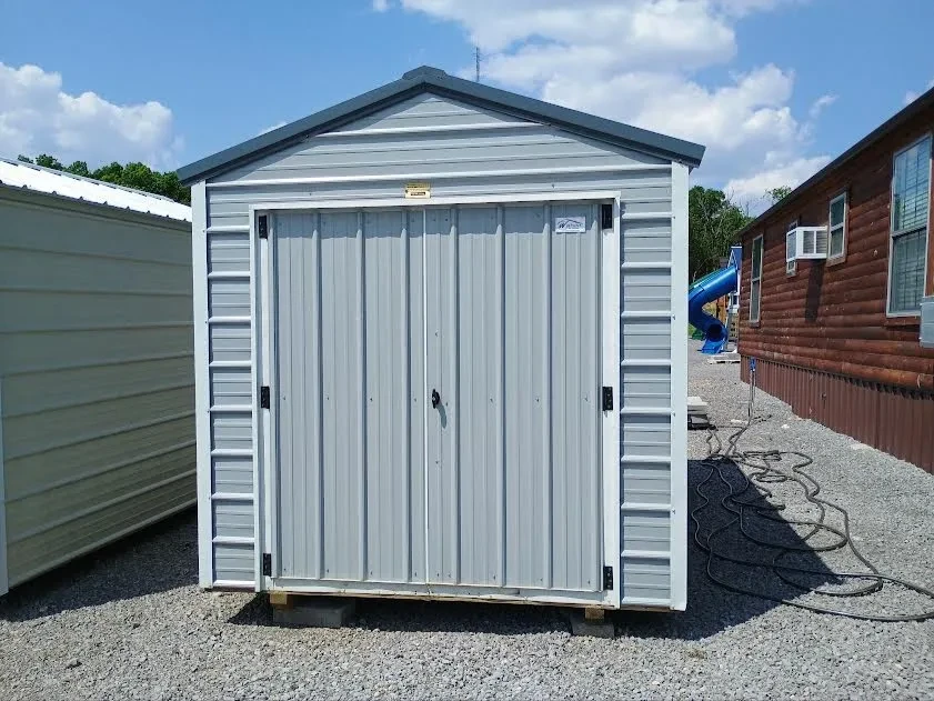 Outside of 8x12 value metal shed with double doors.
