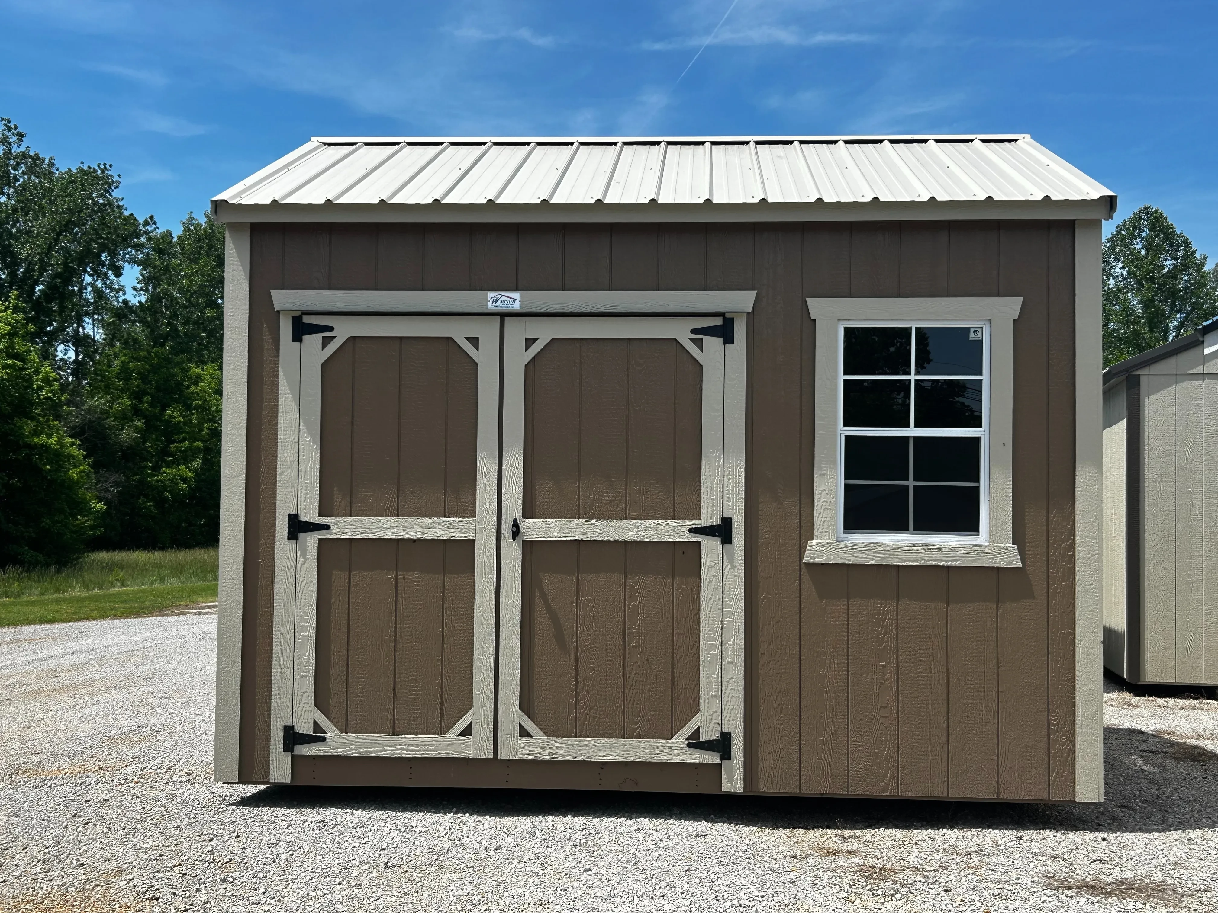 Face view of 10x12 wooden garden shed showing doors and window