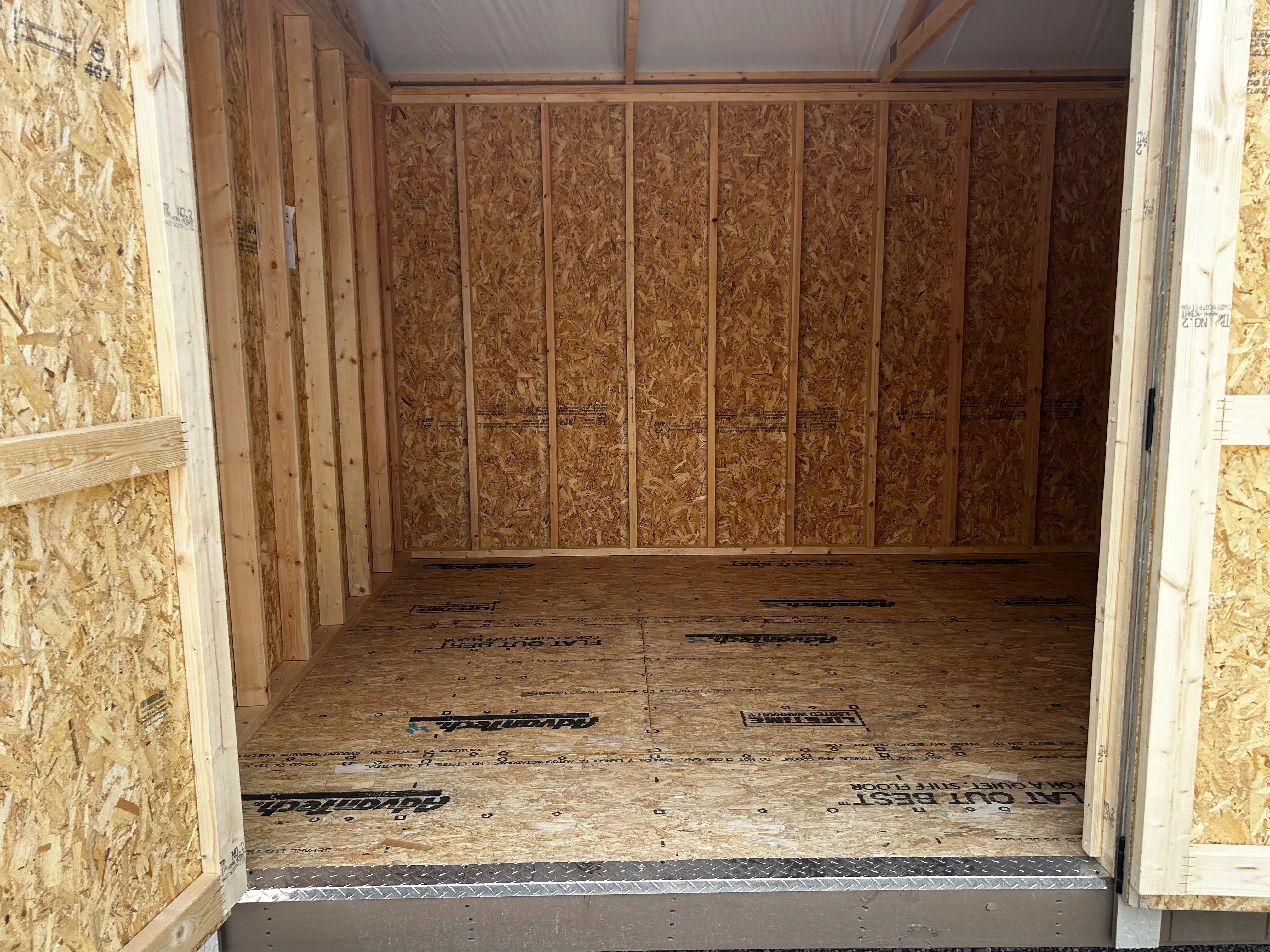 Doorway of 10x12 garden shed showing floor and diamond plate.
