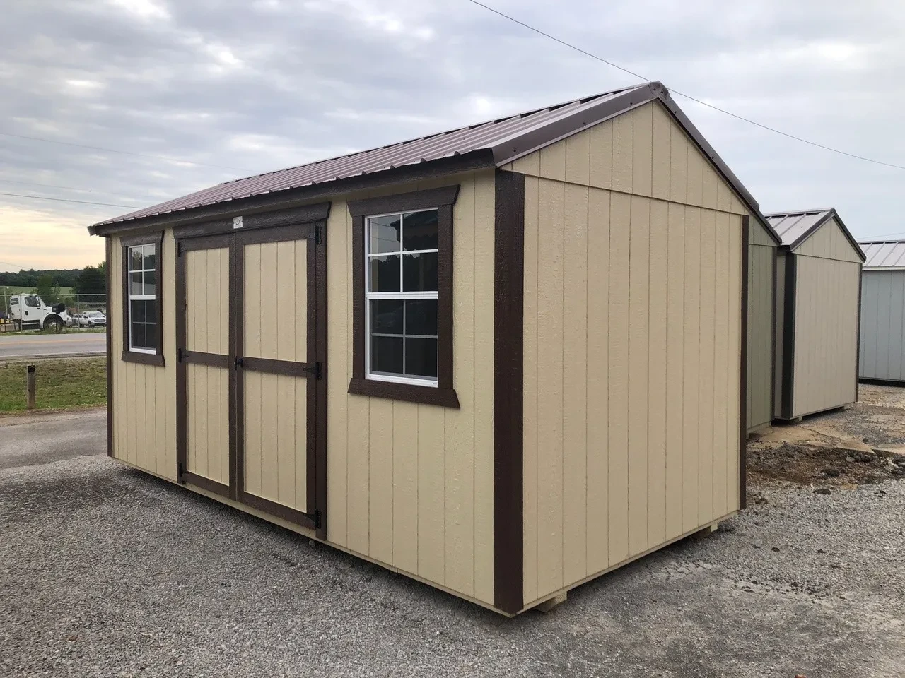 exterior of shed showing double doors and windows
