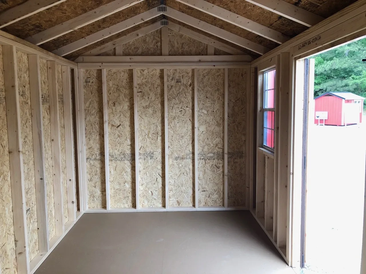 interior of shed showing a window and part of the doorway