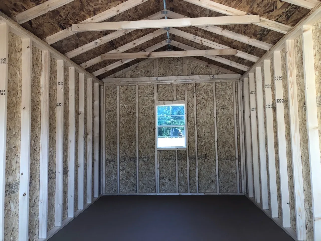 interior of 10x16 utility showing a window and floor