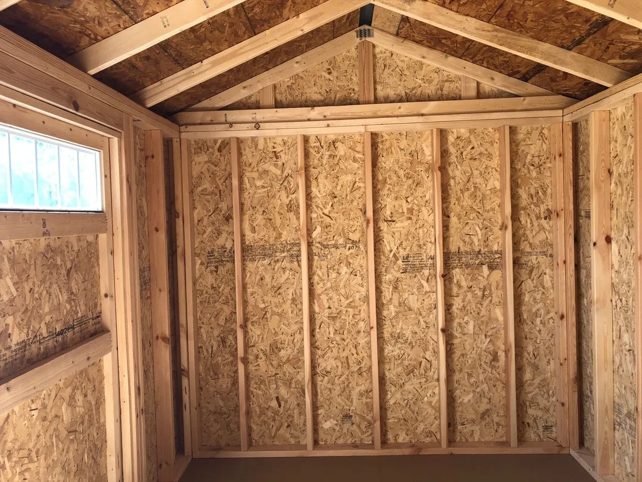 interior of 8x12 garden shed showing half of door