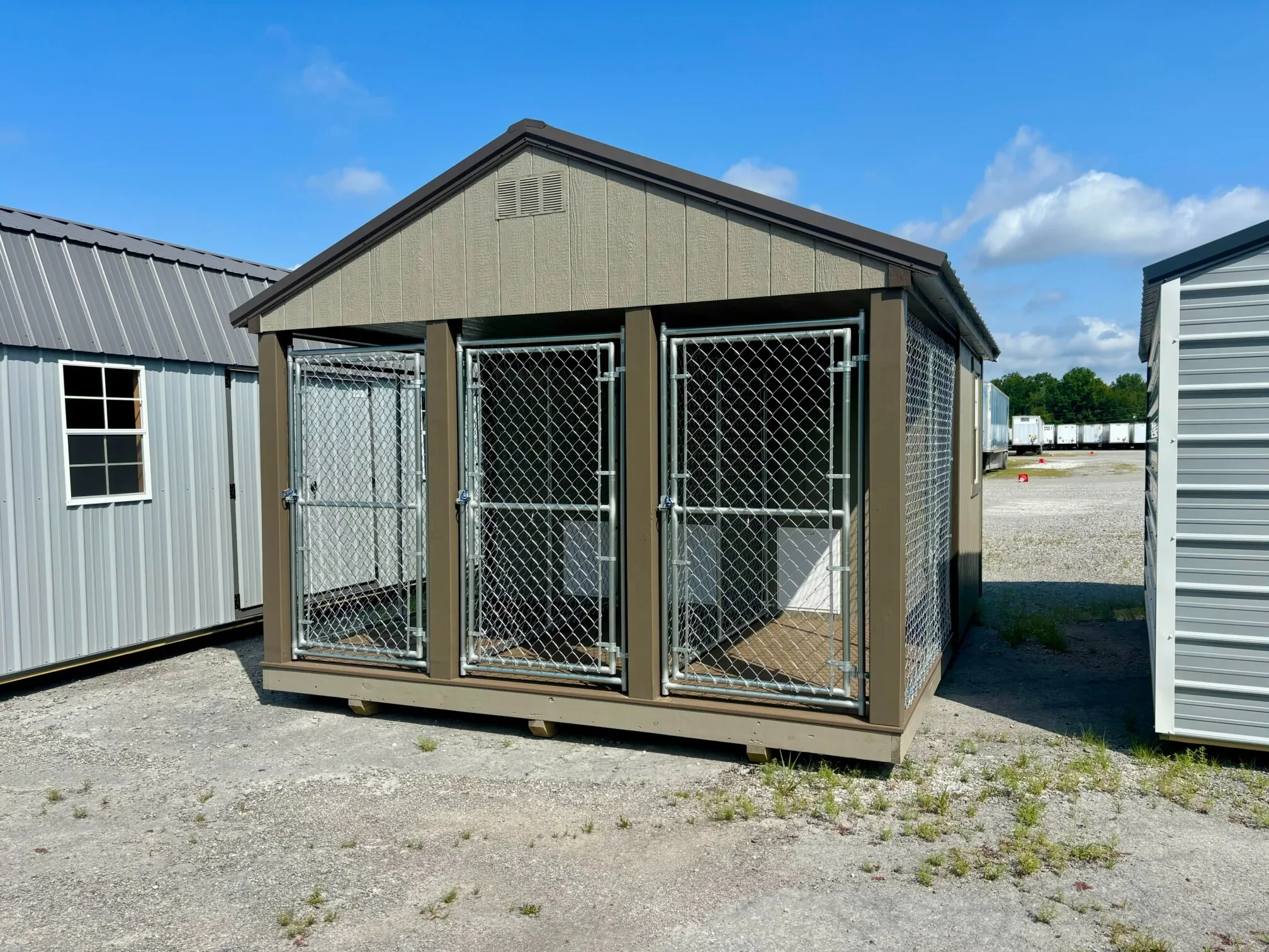 A dog kennel showing chain link fence installed