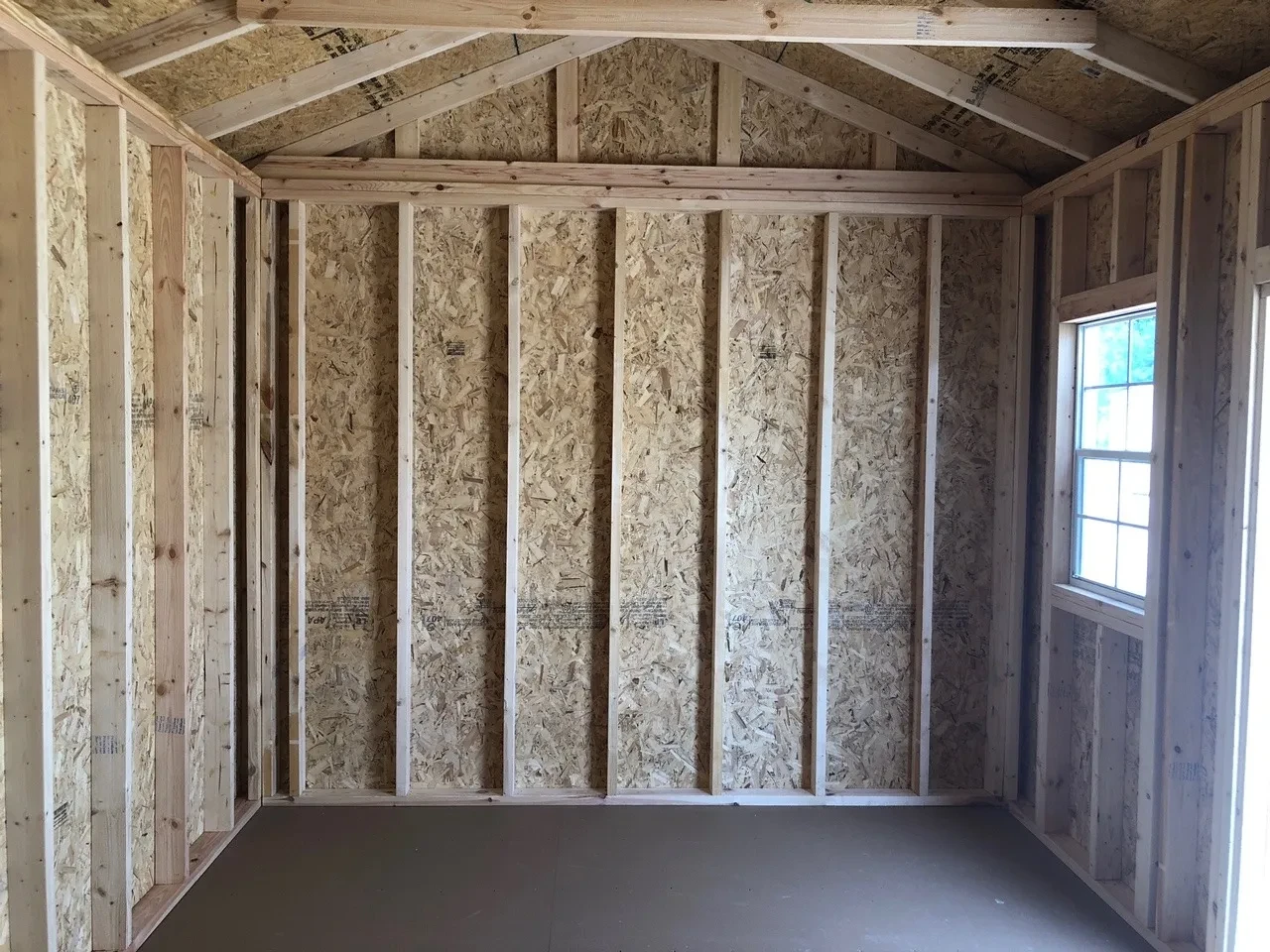 interior of 10x16 garden shed showing 1 window and floor
