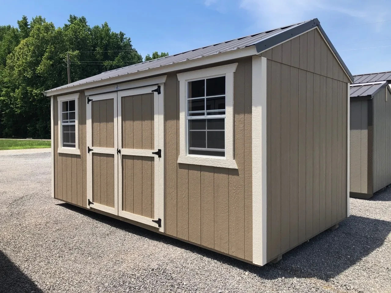 exterior of 8x16 garden shed showing double doors and 2 windows