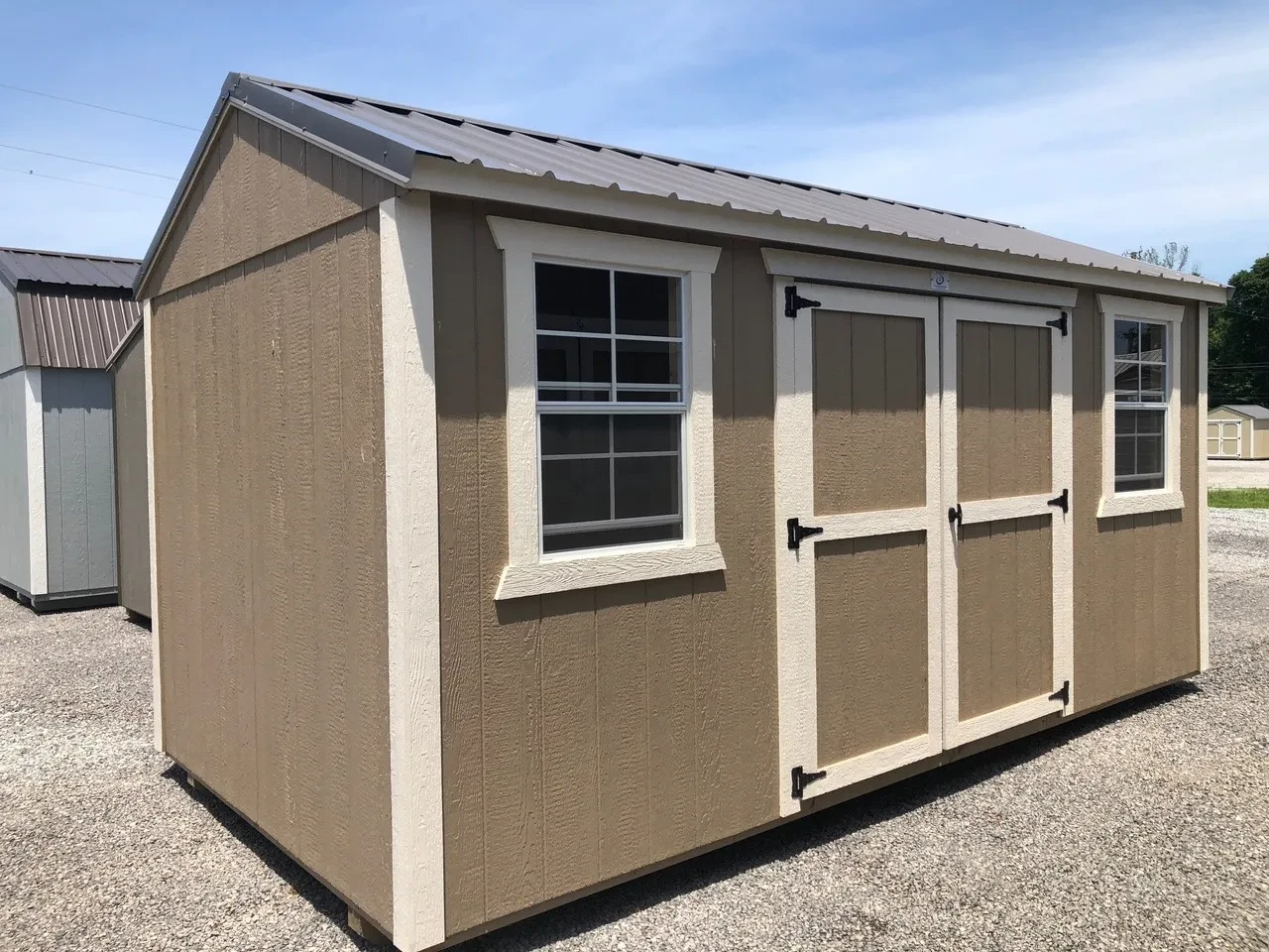 exterior of 8x16 garden shed showing double doors and 2 windows