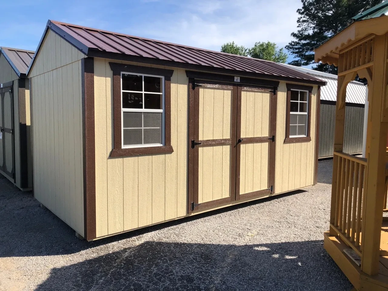 exterior of 8x16 garden shed showing double doors and 2 windows